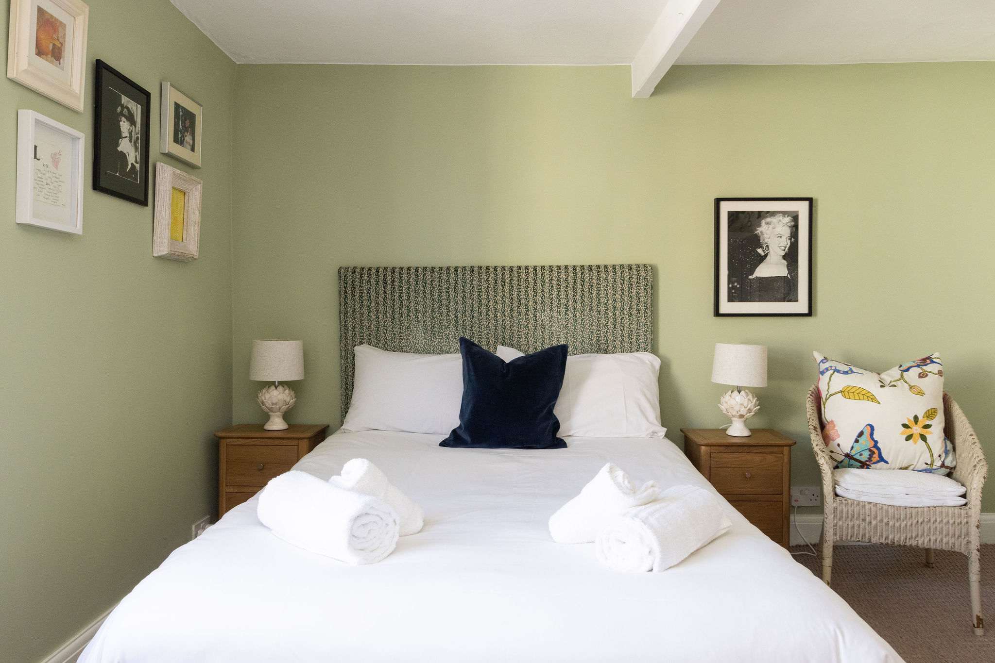 Peaceful first floor double bedroom with soft green tones
