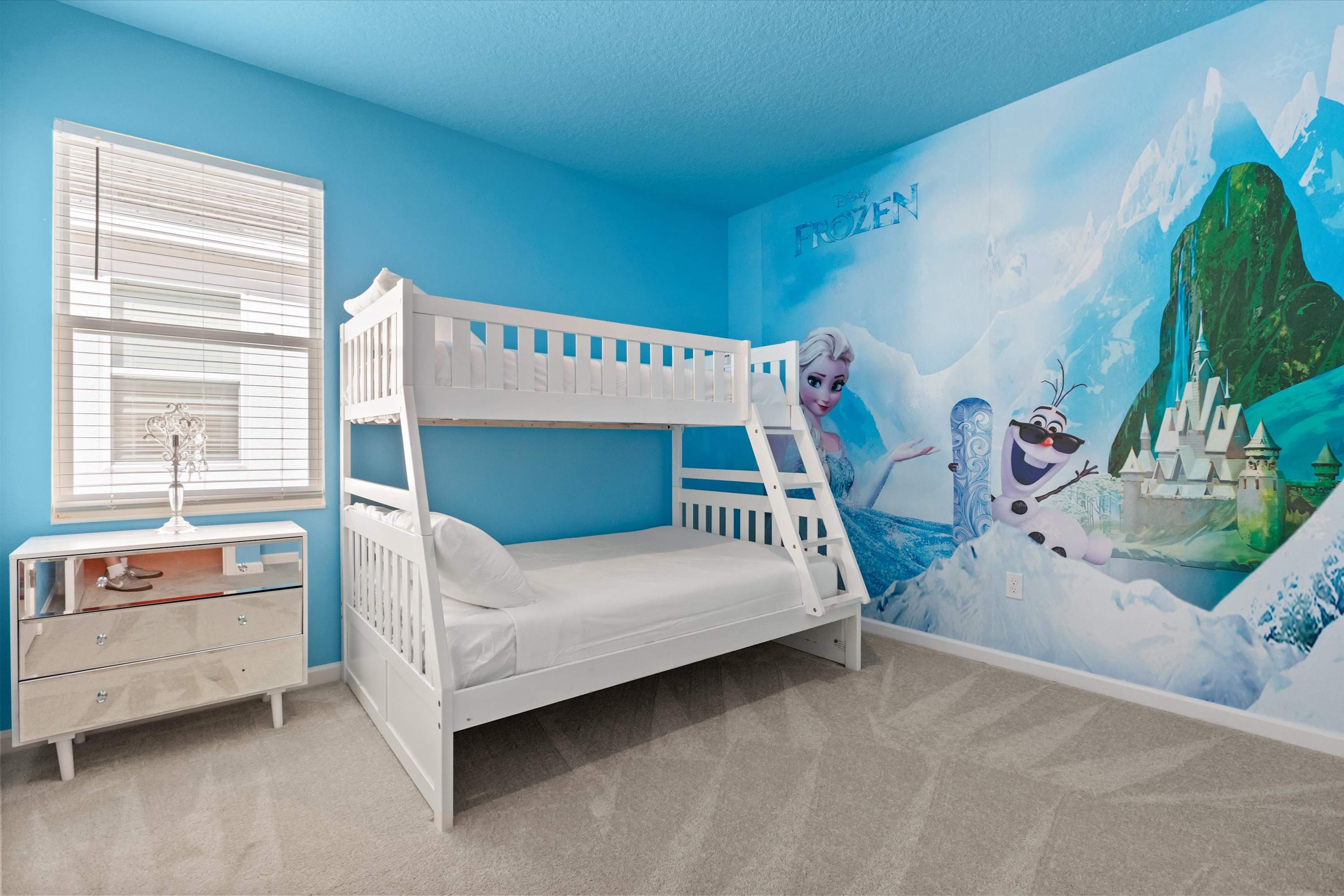 Bedroom 12 – Frozen Themed Room: Bring the magic of Frozen to life in this icy blue bunk room — a dream come true for little adventurers.