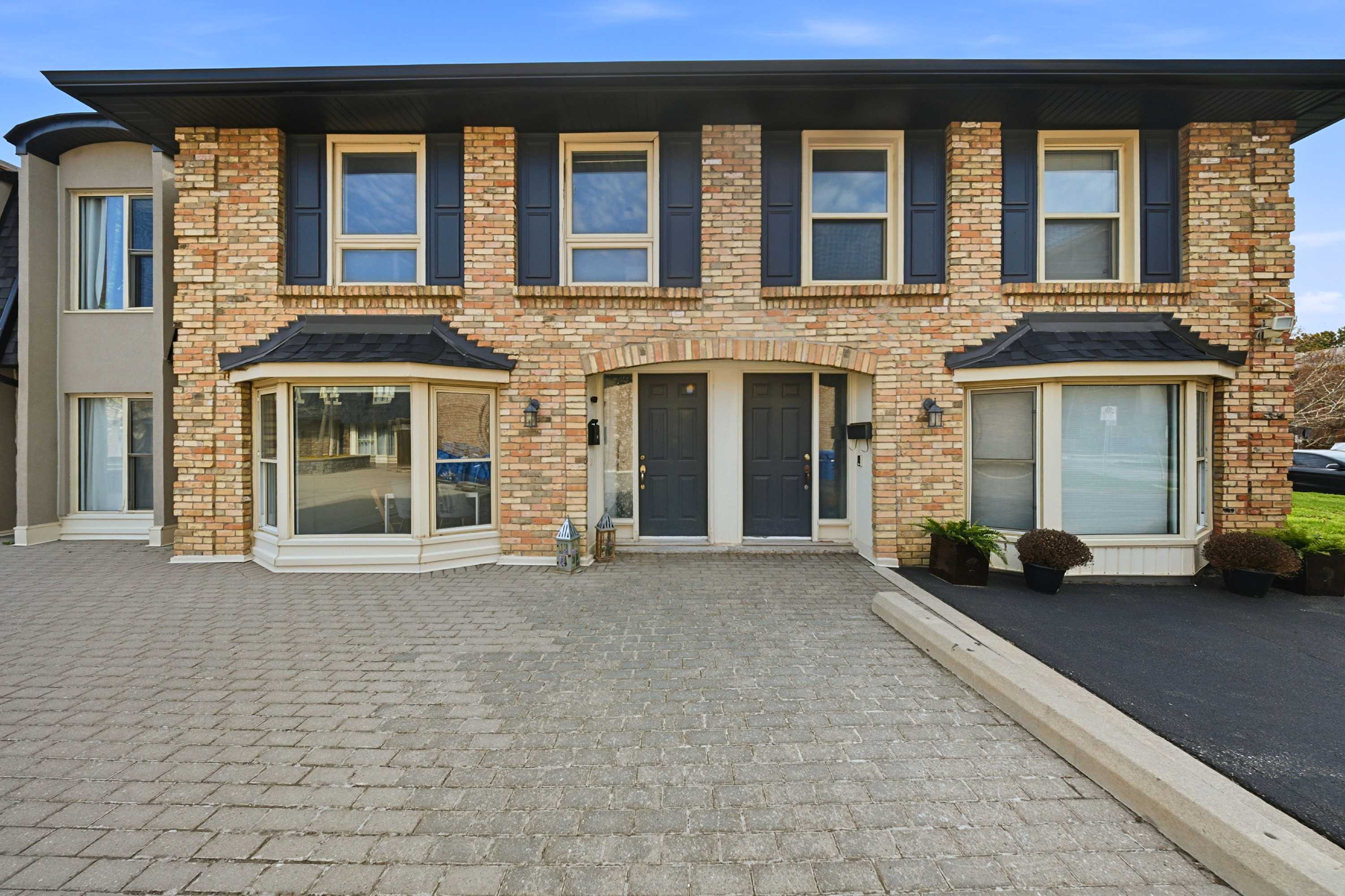 Modern townhouse exterior with private entrance and parking