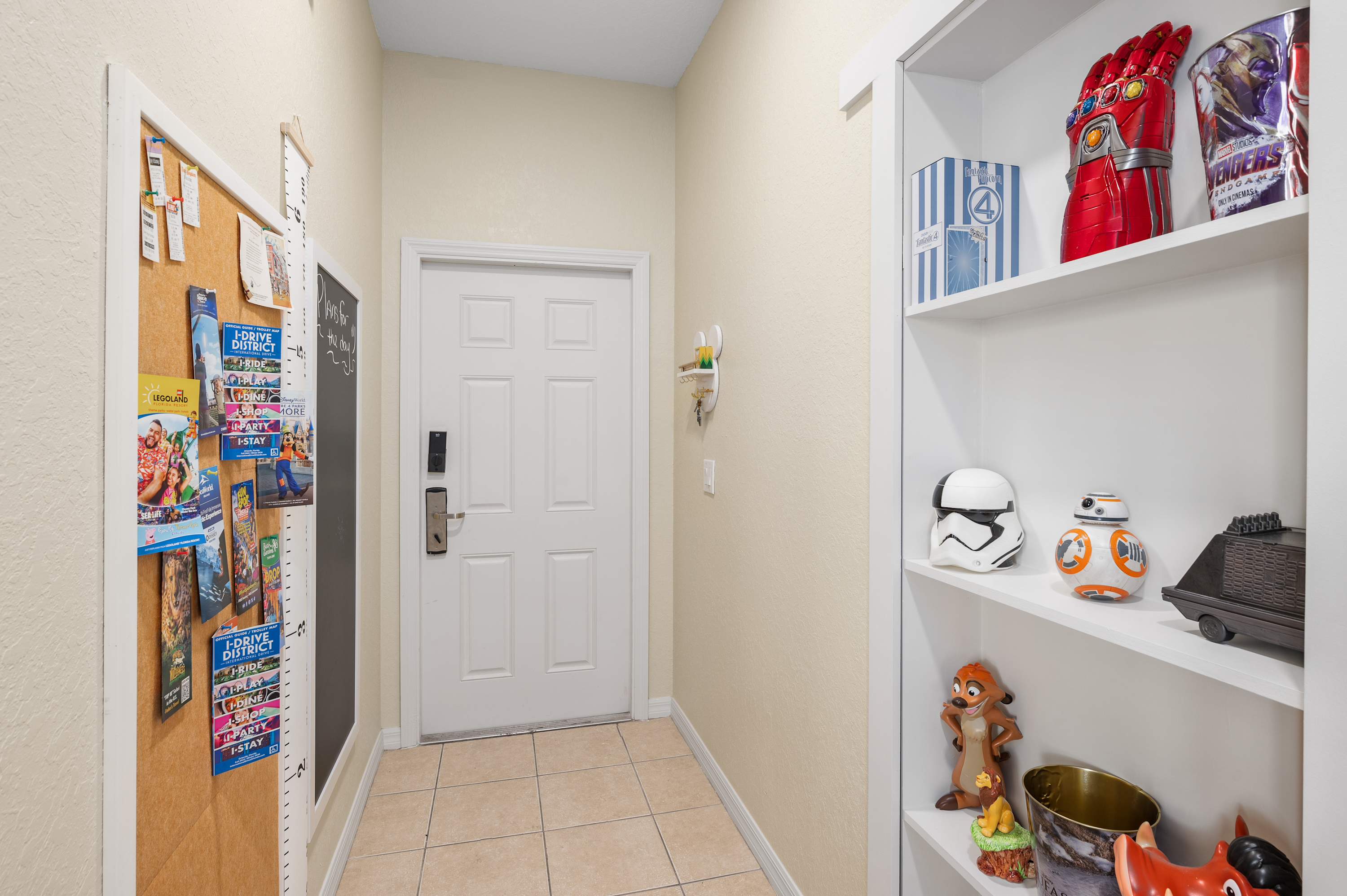 Bright hallway w/ wall decor & shelving for a homey first impression