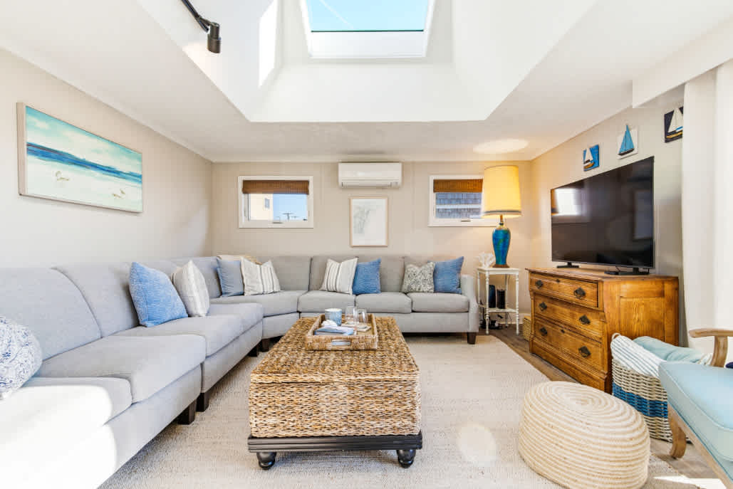 Curl up in the airy living room & stream your favorites on the smart TV​
