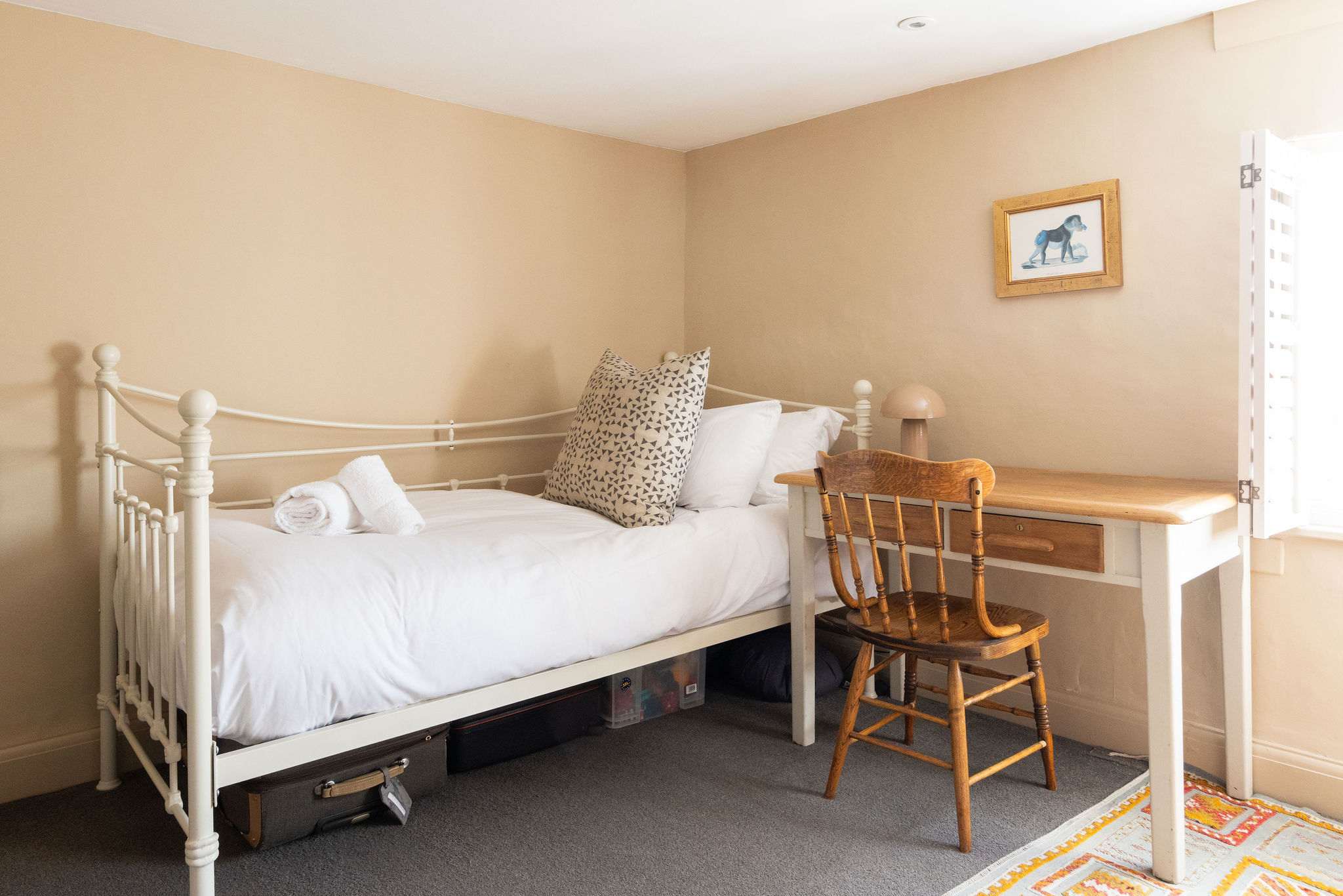The 4th bedroom contains 1 single bed and desk