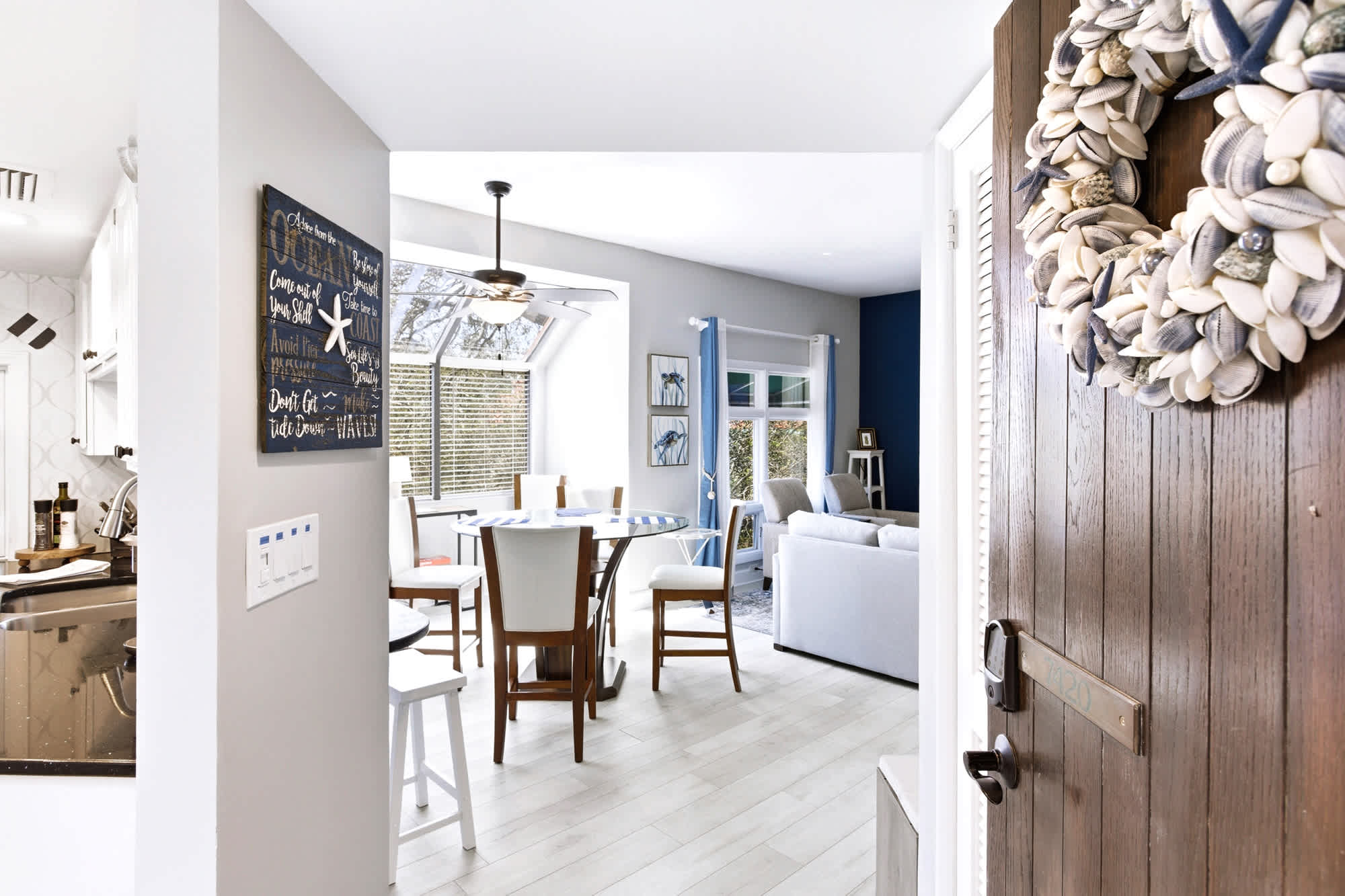 Step inside to bright, beachy interiors - flip-flop friendly the moment you walk in, with a 'BEACH' chalkboard greeting and seashell-wreath door!