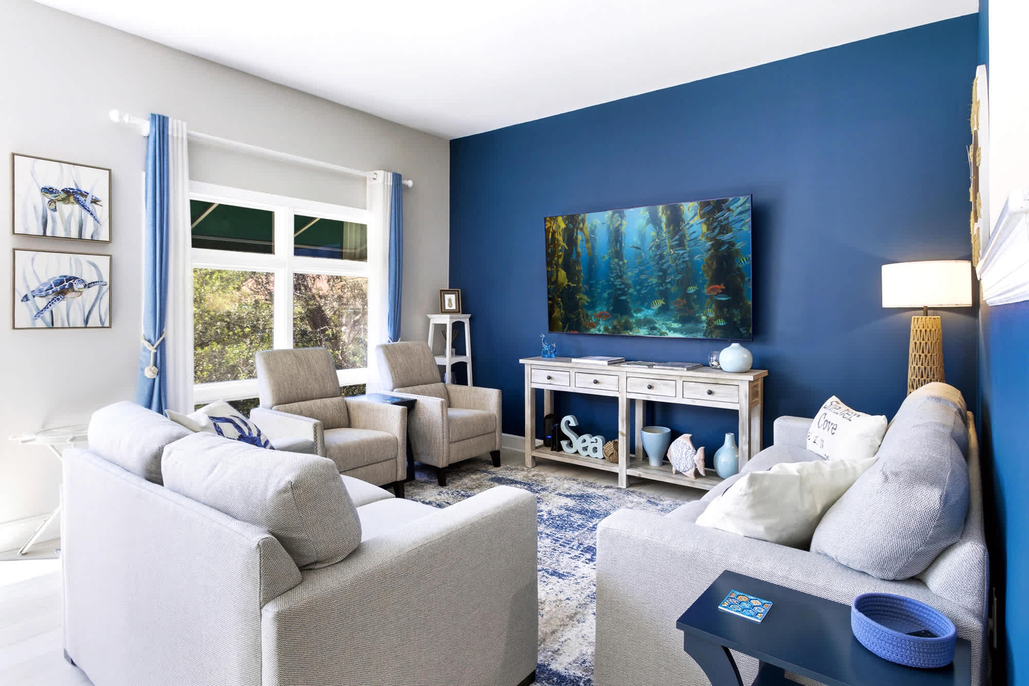 Plenty of comfy seating for the whole crew, anchored by a wall-mounted TV - perfect for movie nights and lazy afternoons in!