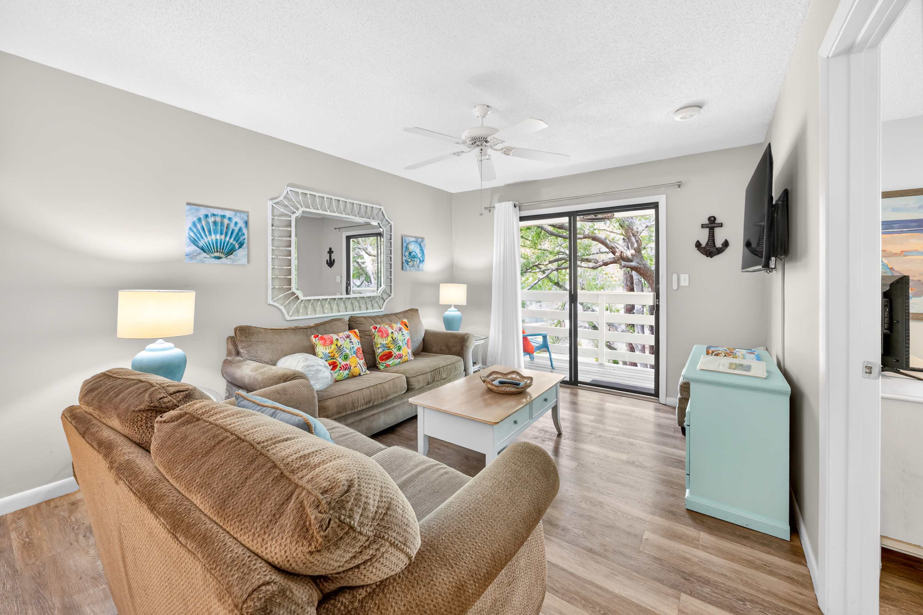 Cozy living area with a balcony view.