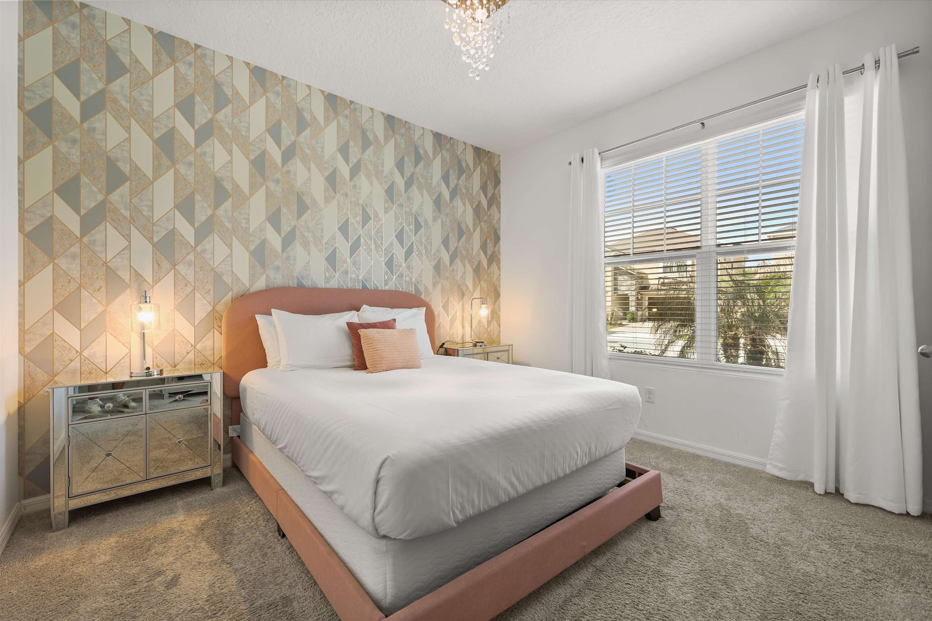 Bedroom with a comfortable queen size bed dressed in fresh, smooth linens for a crisp, clean, and restful stay.