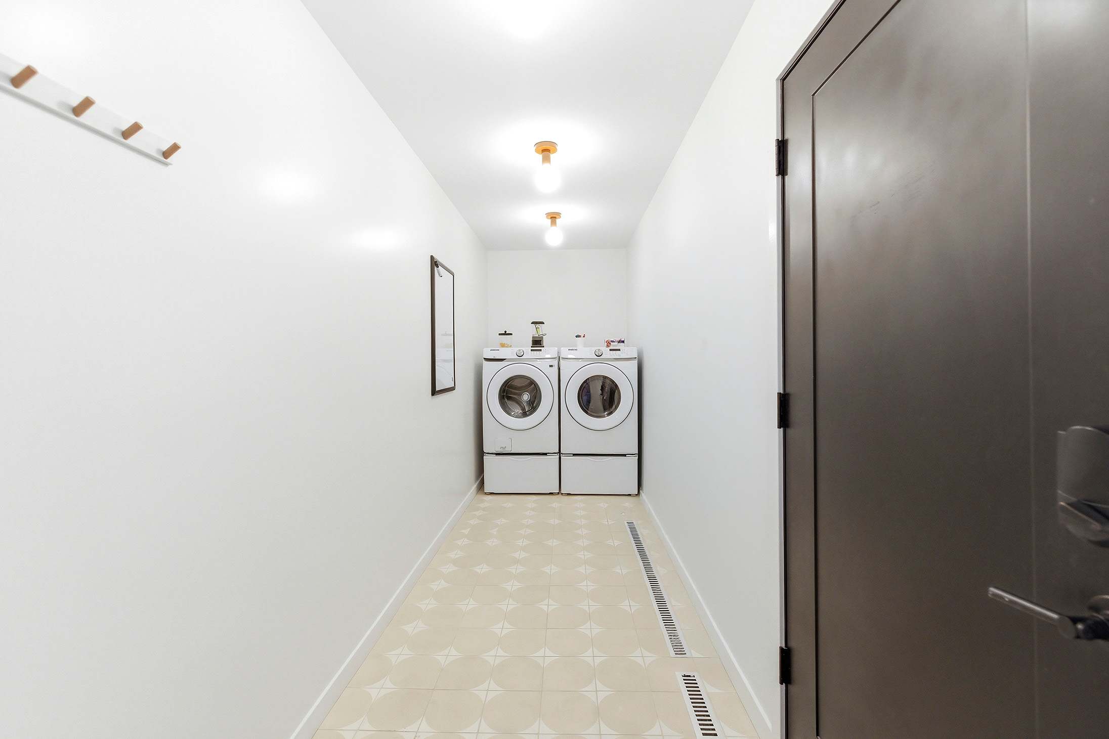 Where clothes go to glow up—this laundry space is serving spotless and stylish.