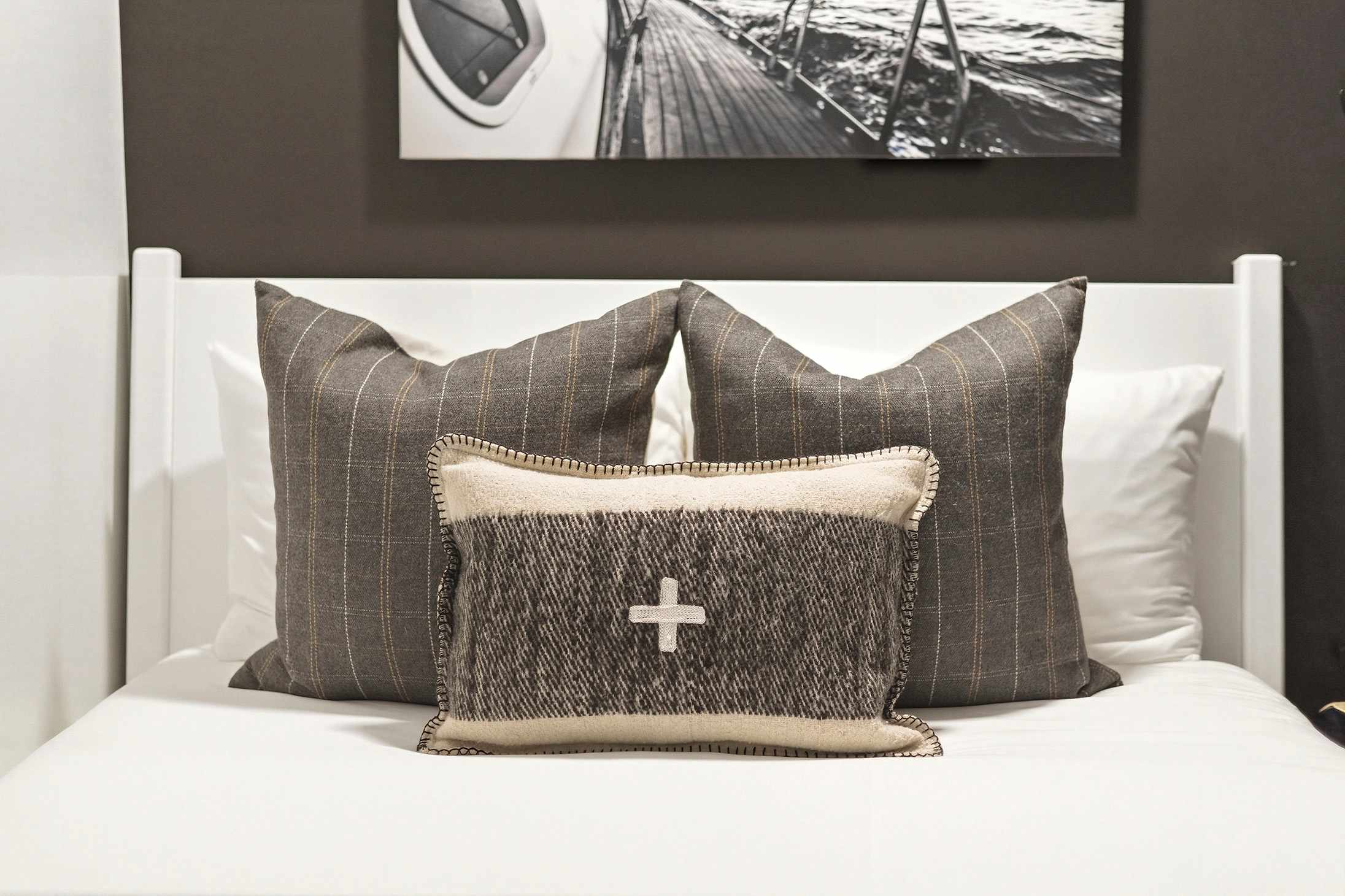 When your pillows are as stylish as your art—this bed knows how to make a statement.