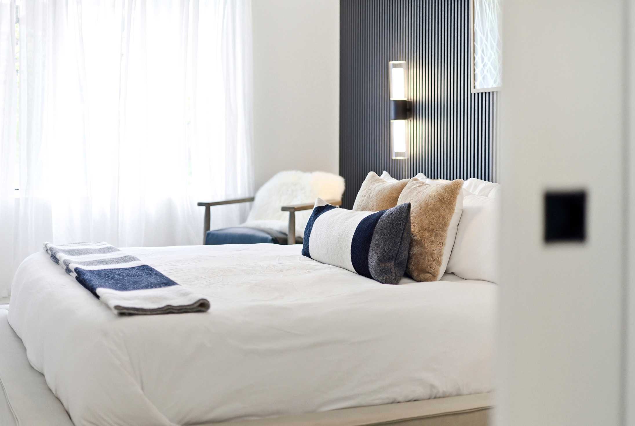 Primary bedroom is on the main level & has a king-size bed.