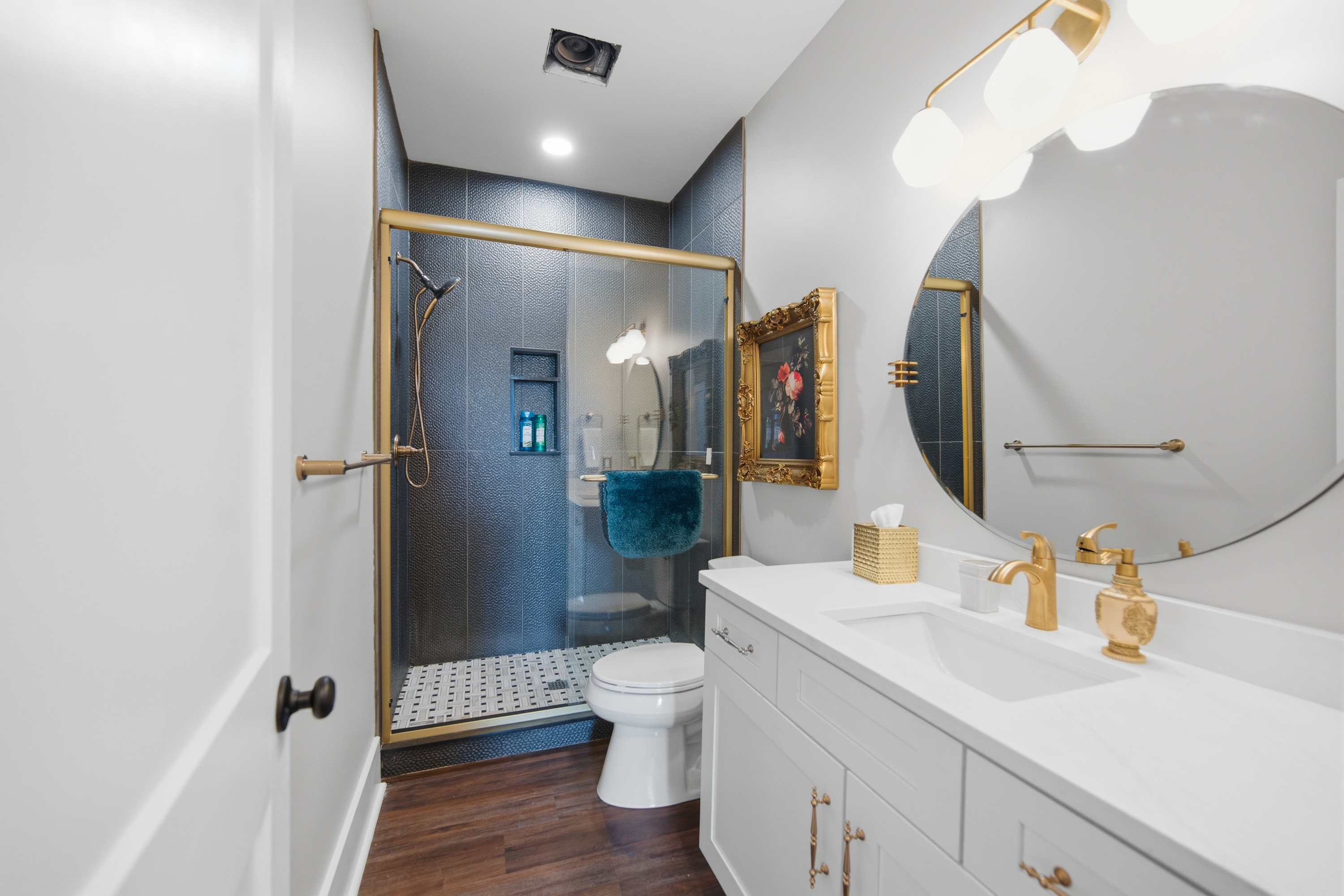Wash up in the full bath, offering a single vanity & glass shower​