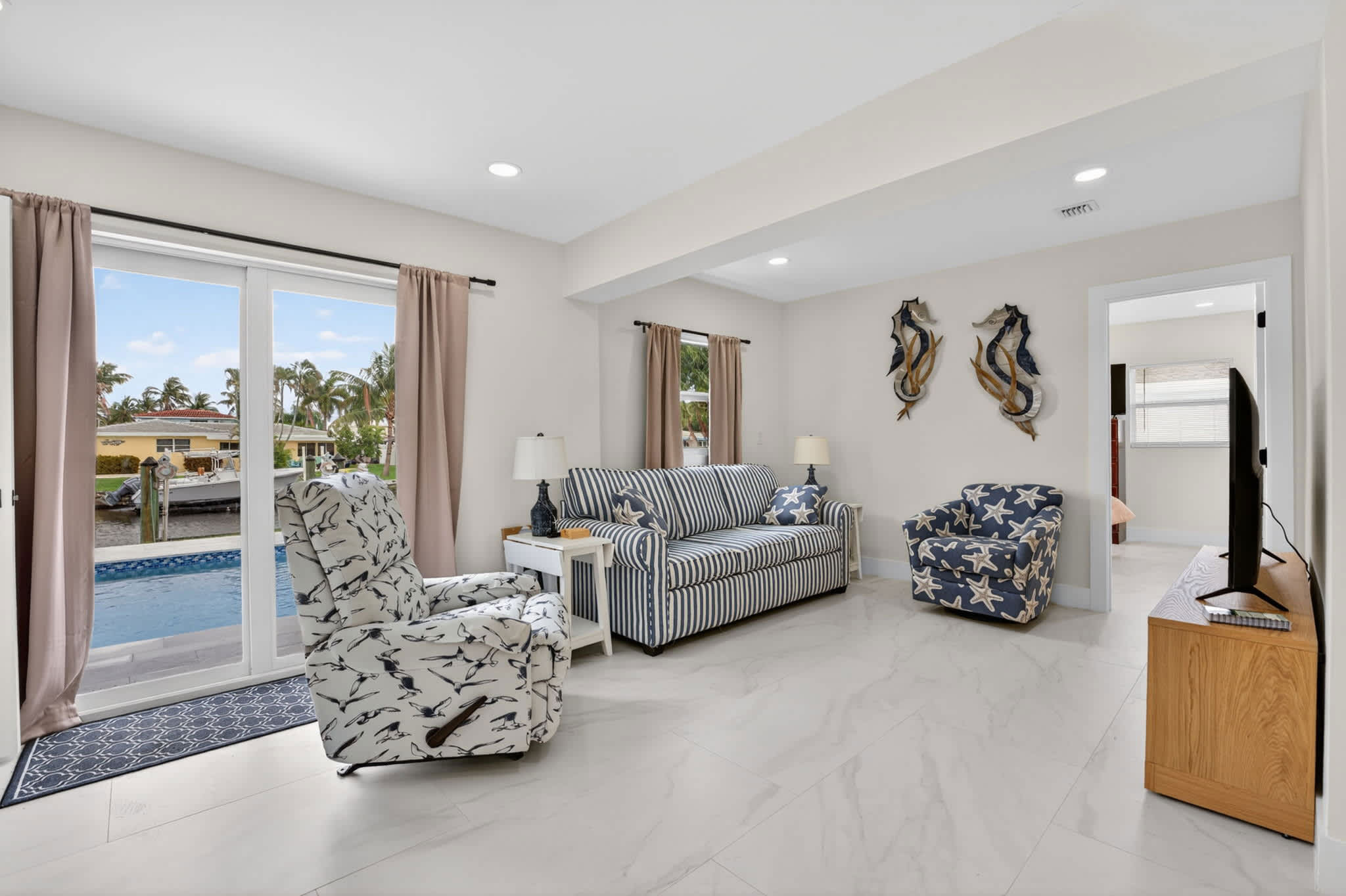 Unwind in the airy living room & stream your favorites on the smart TV​