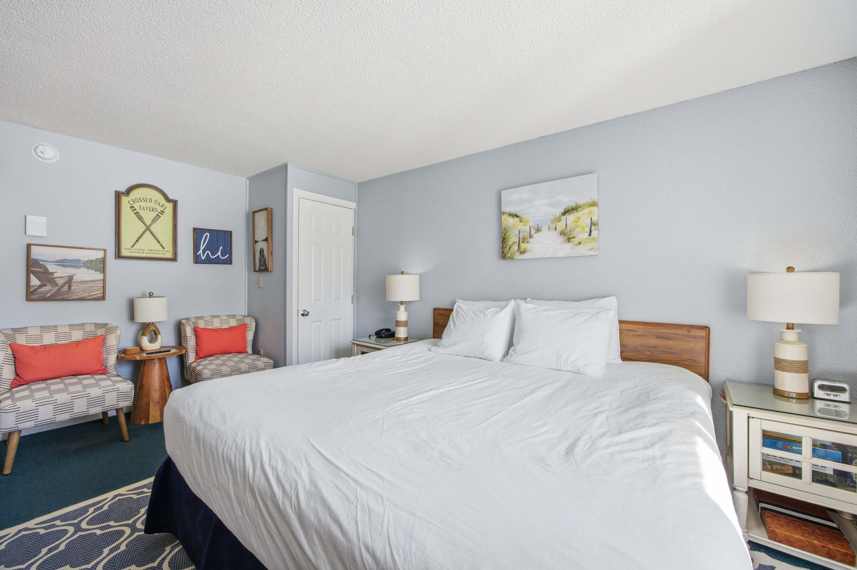 A plush king-sized bed, TV, & full bath await in this charming suite​