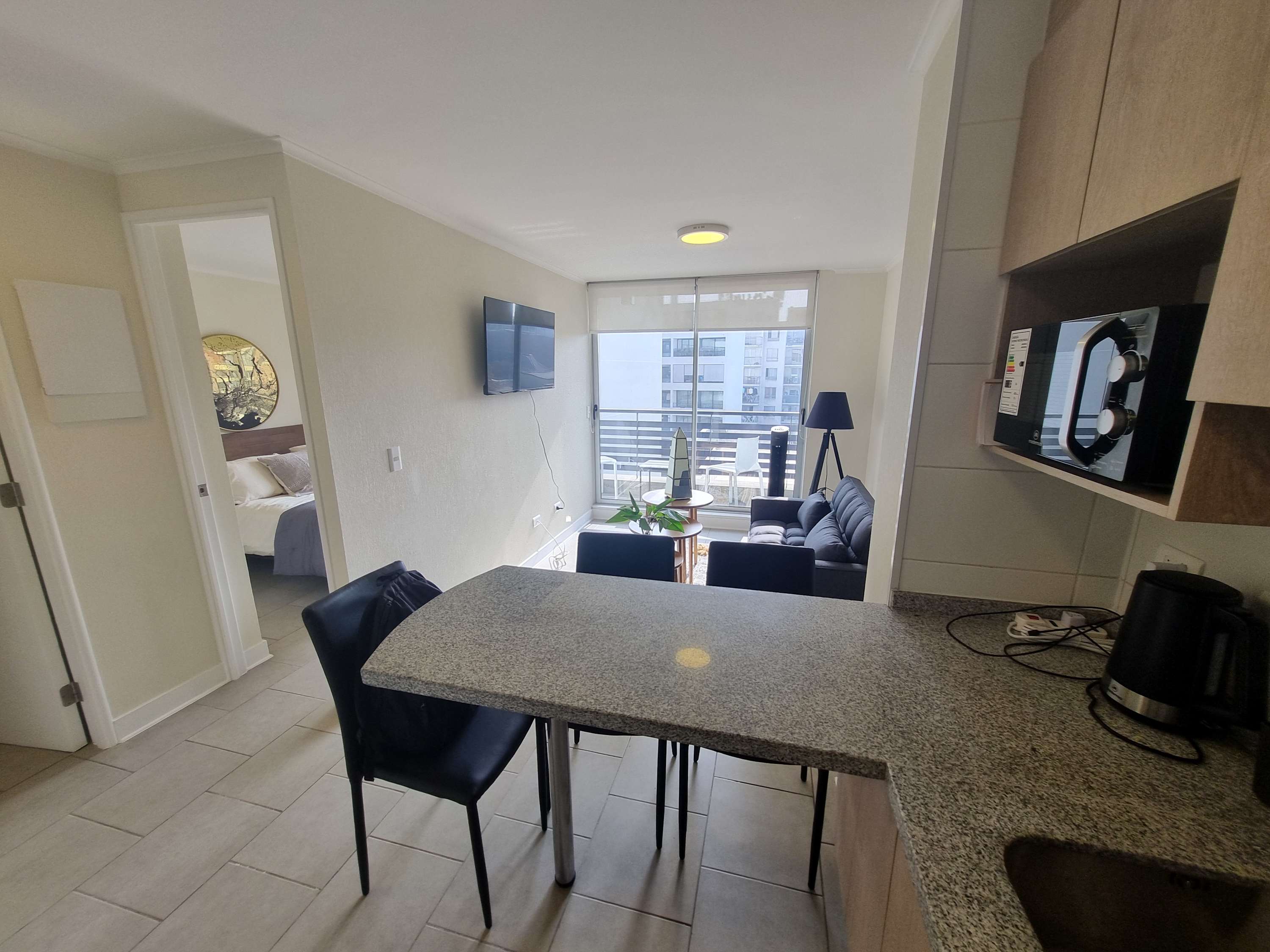 Cozy studio with modern amenities and a stunning city view, perfect for a relaxing stay.