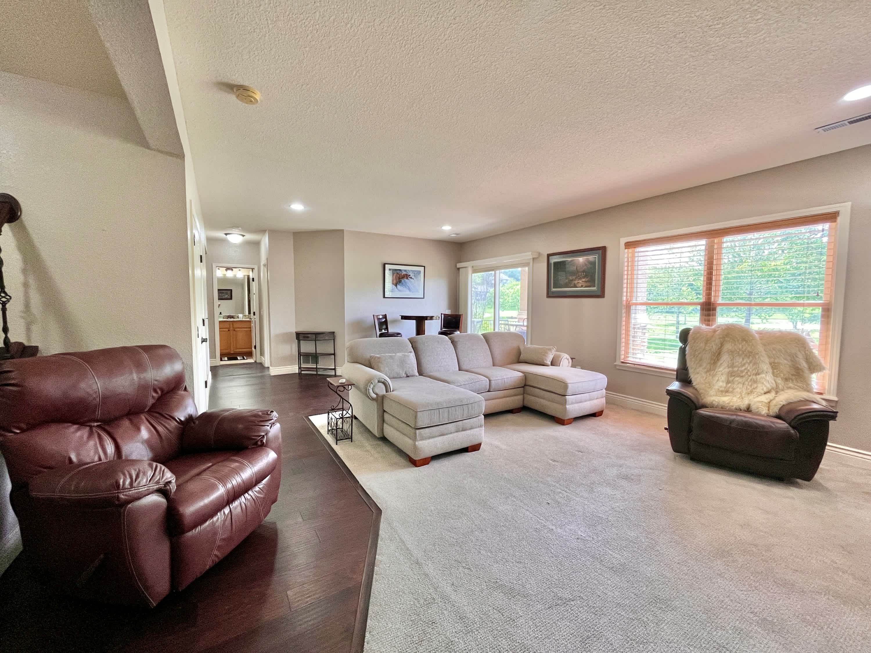 The finished basement den with bar is the ideal spot for epic movie nights​