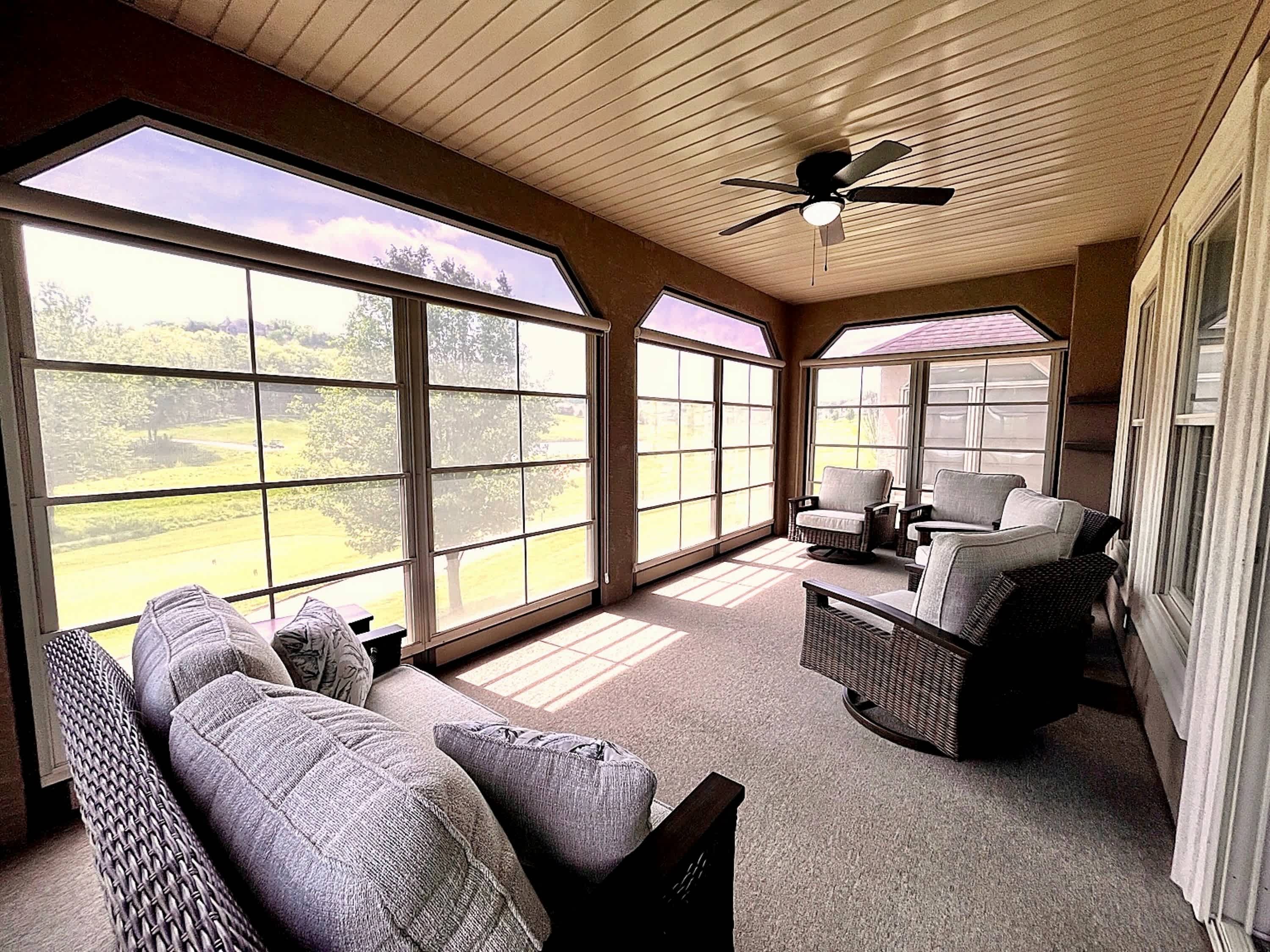 Sip morning coffee or an evening cocktail in the golf course-view sunroom​
