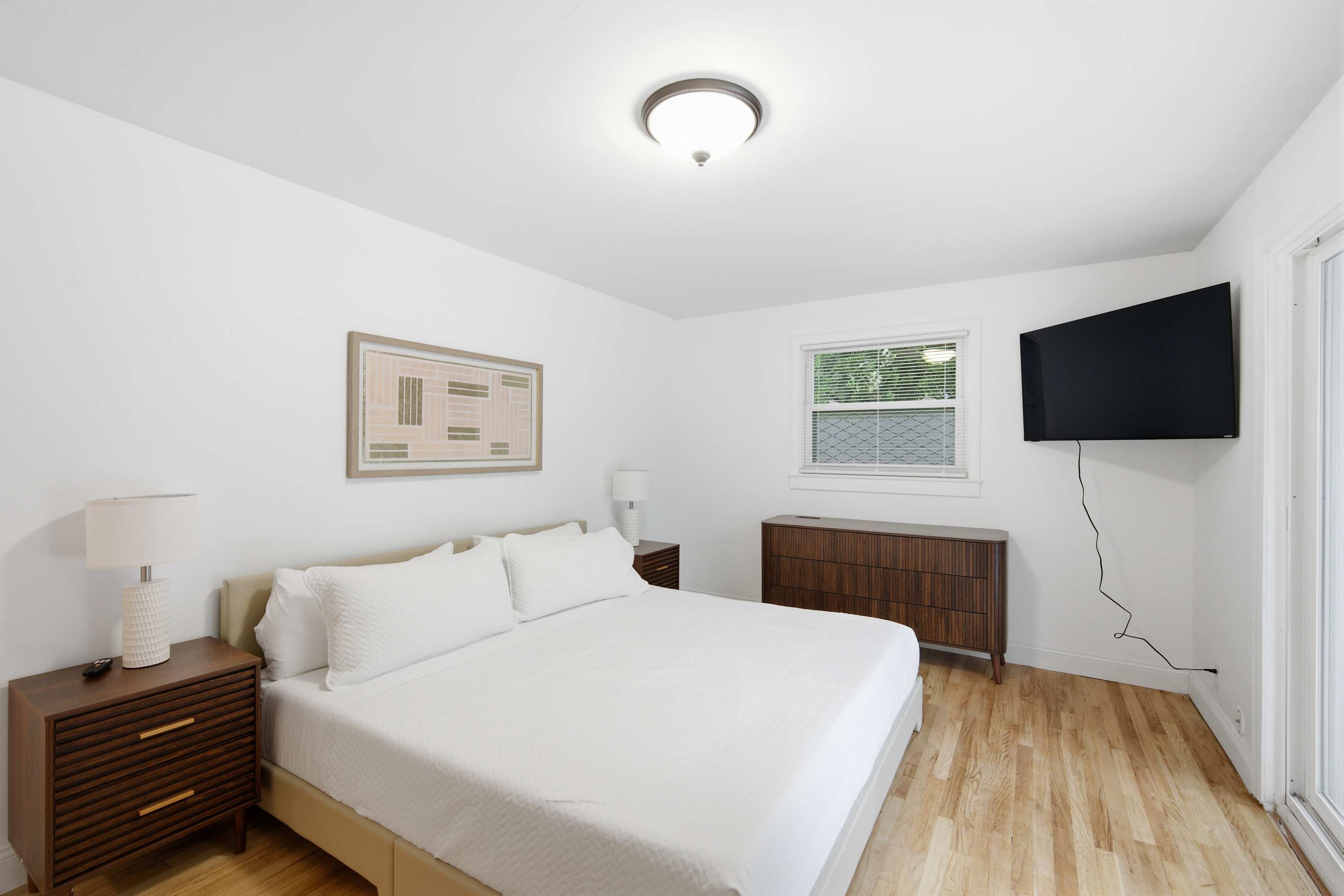 The primary king suite boasts a smart TV, access to the deck, & an ensuite​
