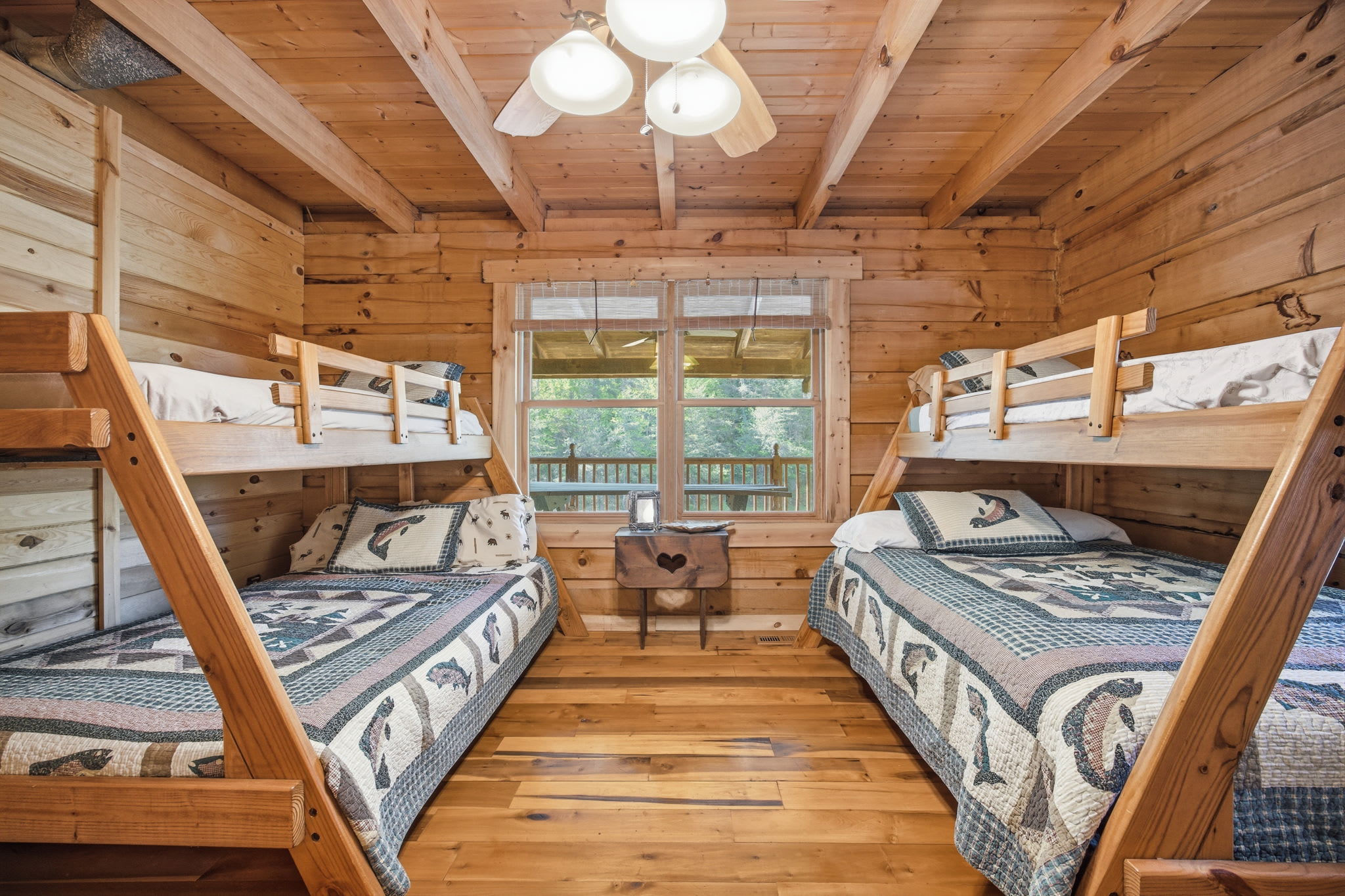 Bedroom off the main floor hallway — two queens and twin bunk beds (sleeps 6)