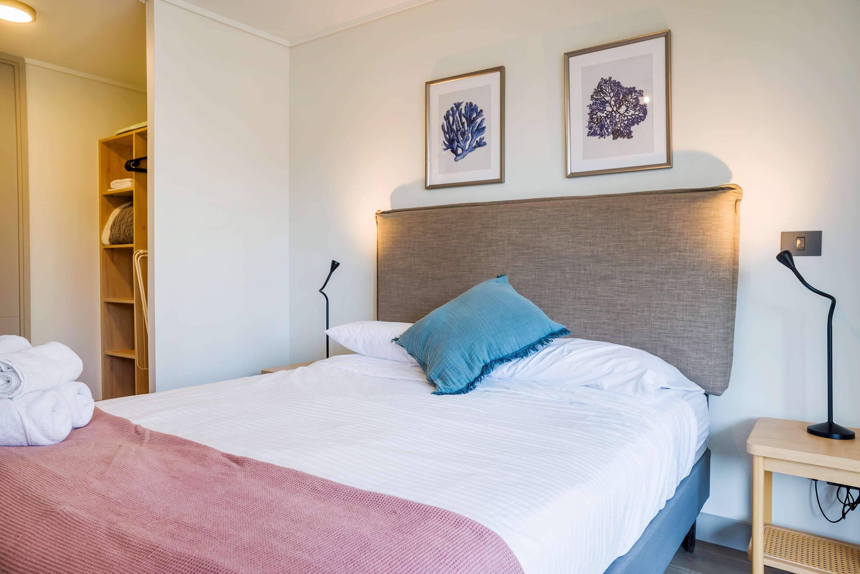 Cozy bedroom with stylish decor and soft lighting, perfect for a restful stay.