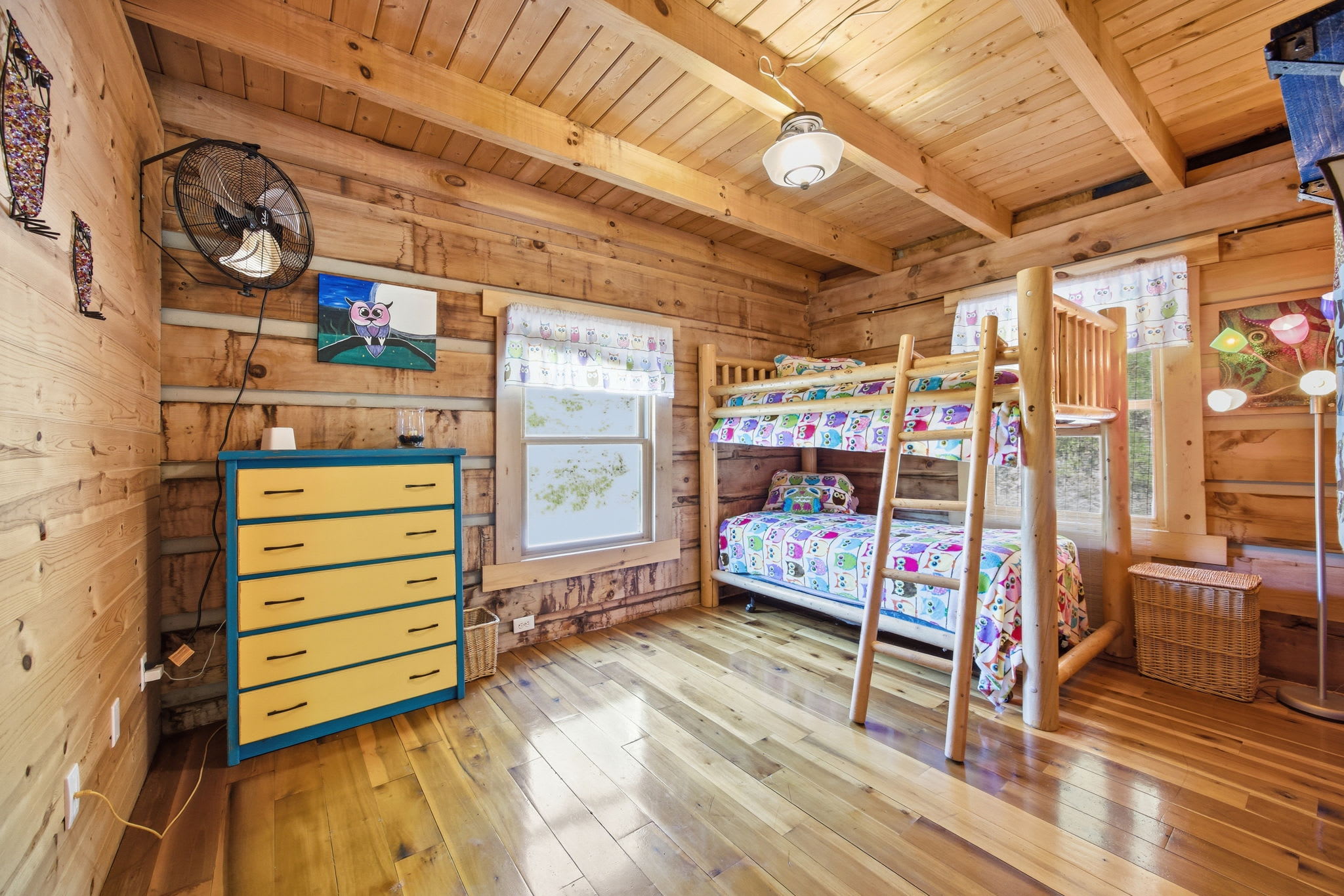 Bedroom at the end of the main floor hallway — two twin beds