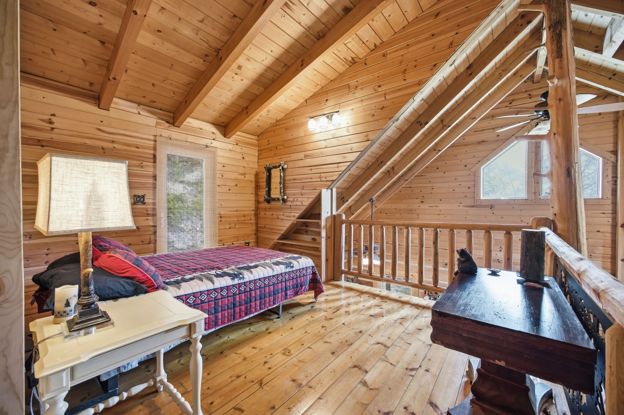 Loft bedroom with a queen bed