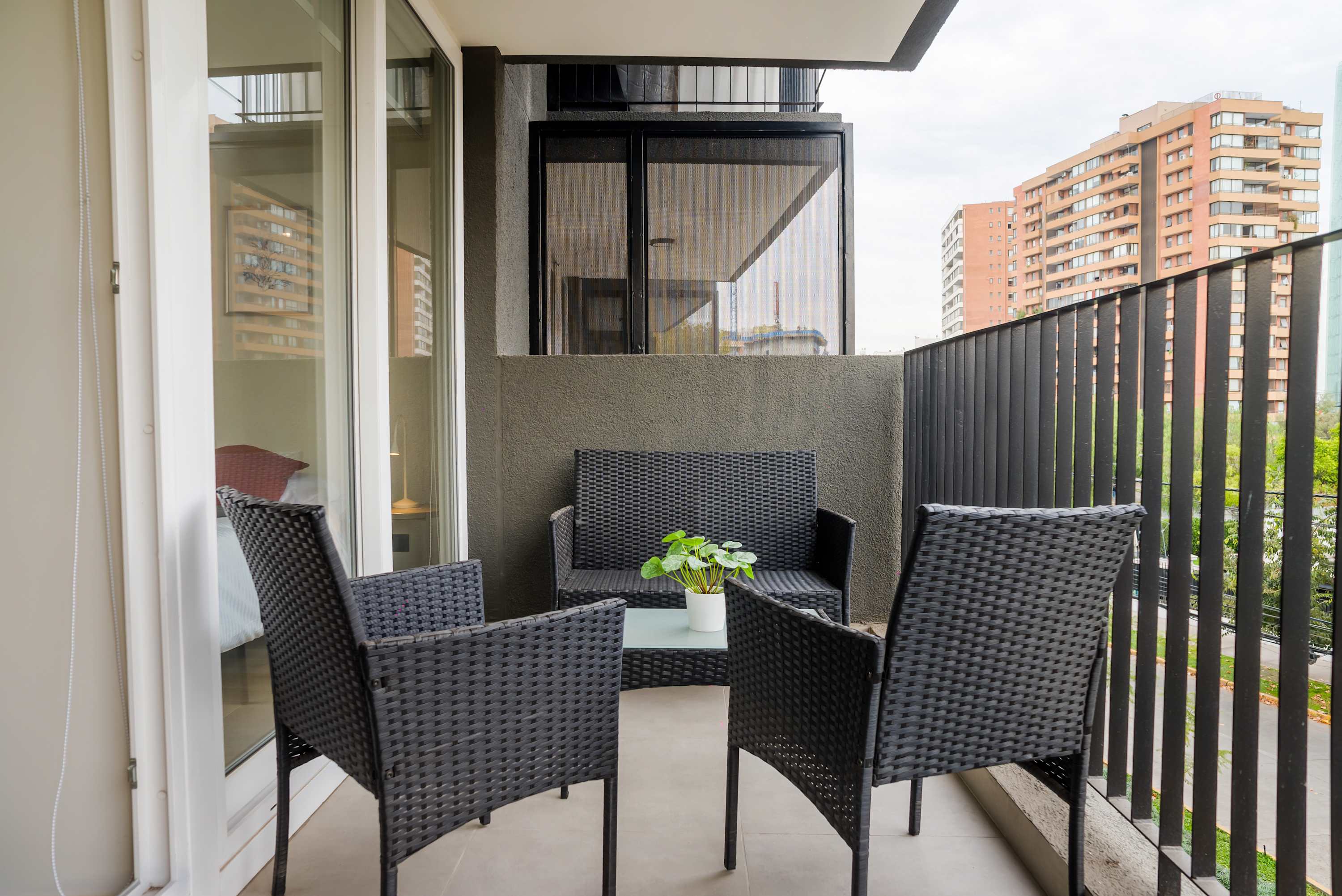 Relax on your private balcony with comfortable seating and enjoy the city views.