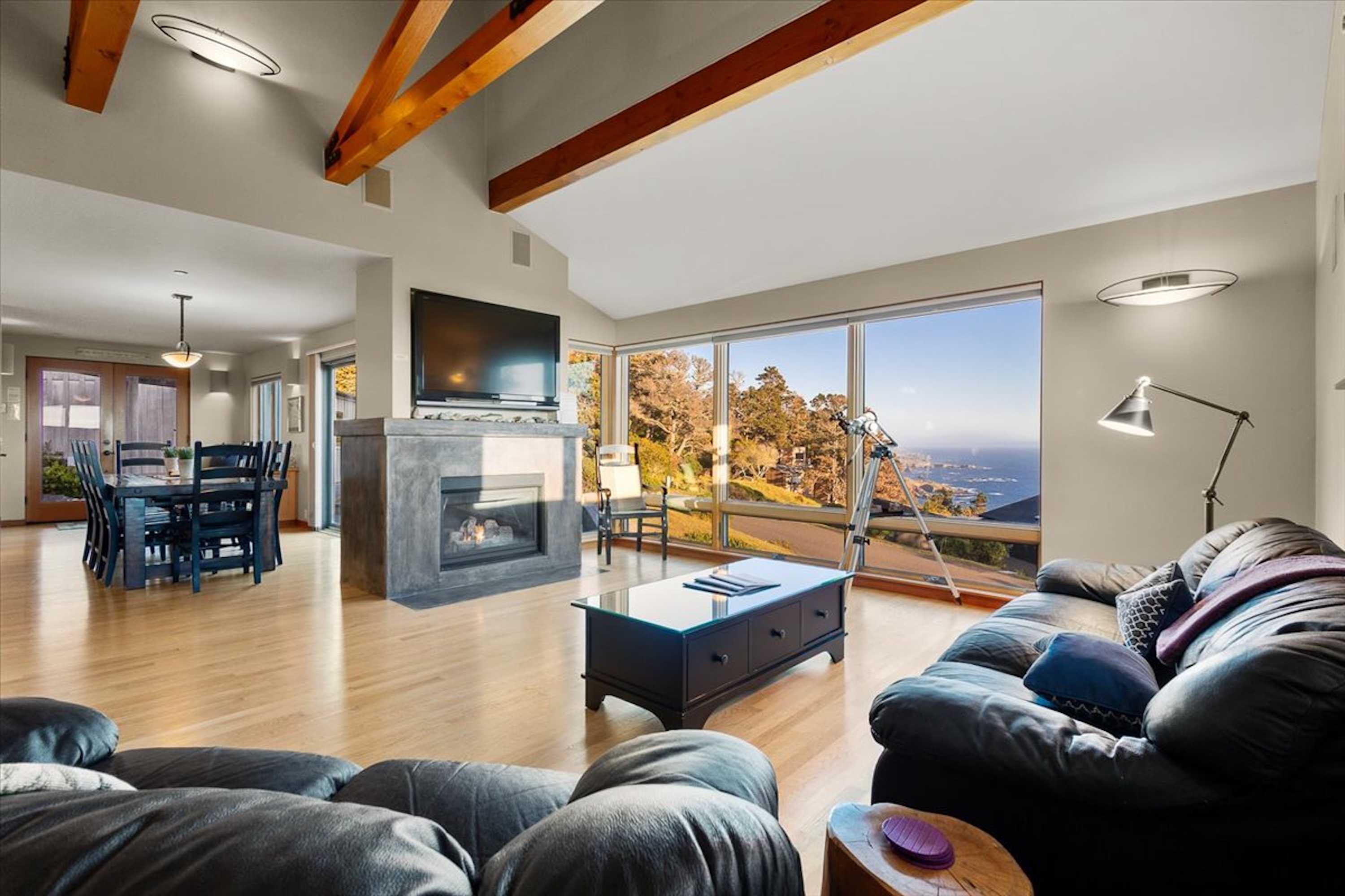 Open living room w/ smart TV & fireplace