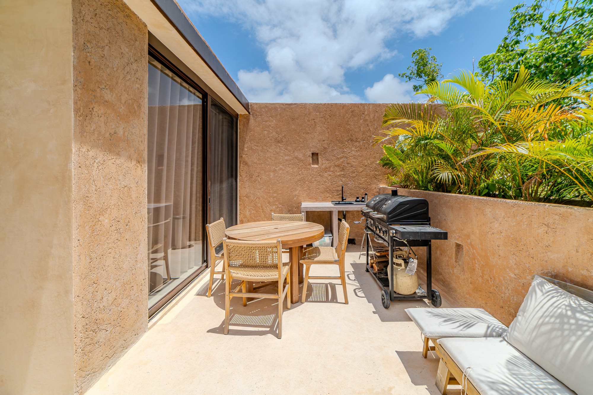 Enjoy the Tulum breeze from your private rooftop, ideal for lounging, grilling, and outdoor meals. + Plunge pool
