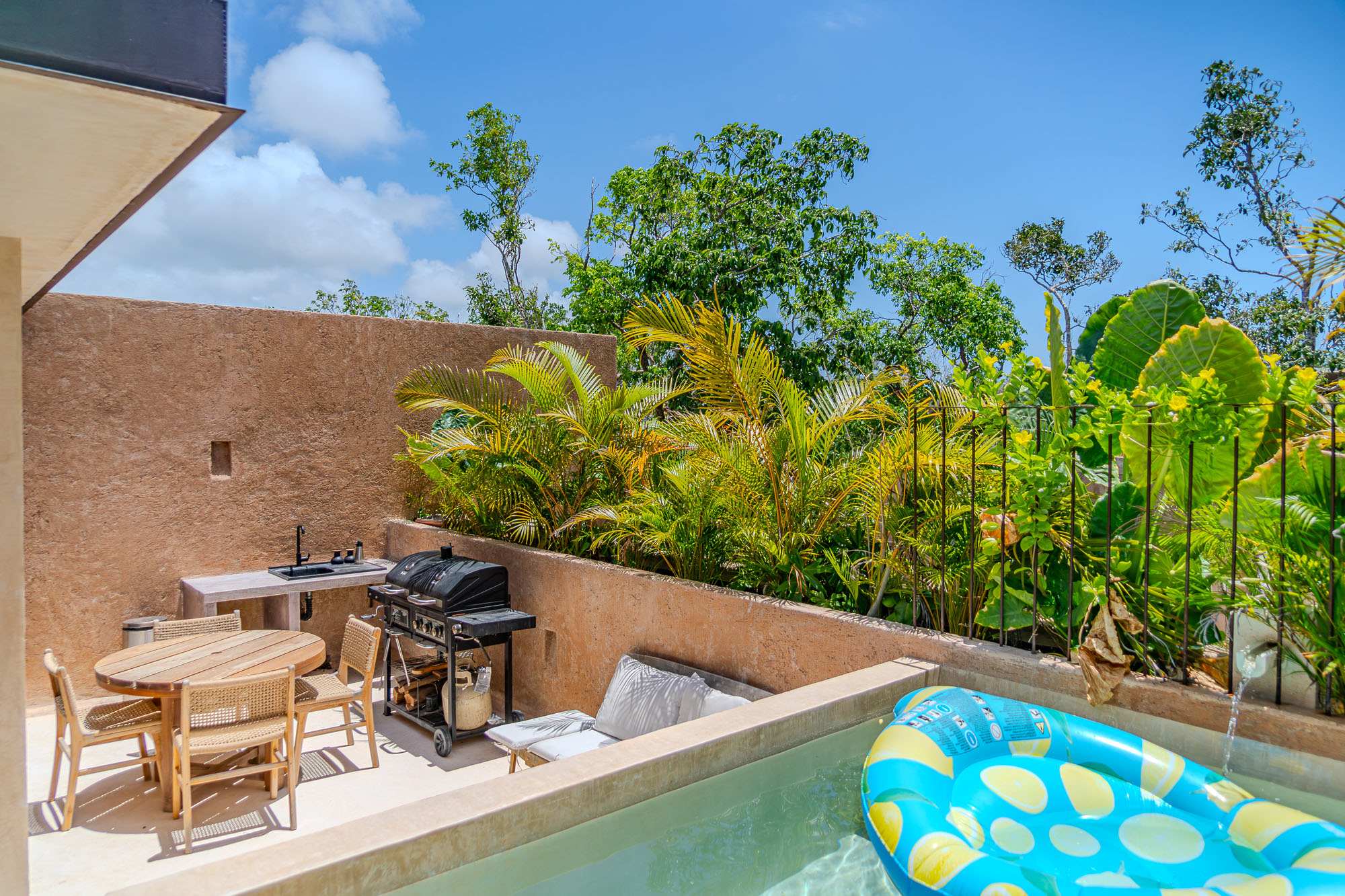 Enjoy the Tulum breeze from your private rooftop, ideal for lounging, grilling, and outdoor meals. + Plunge pool