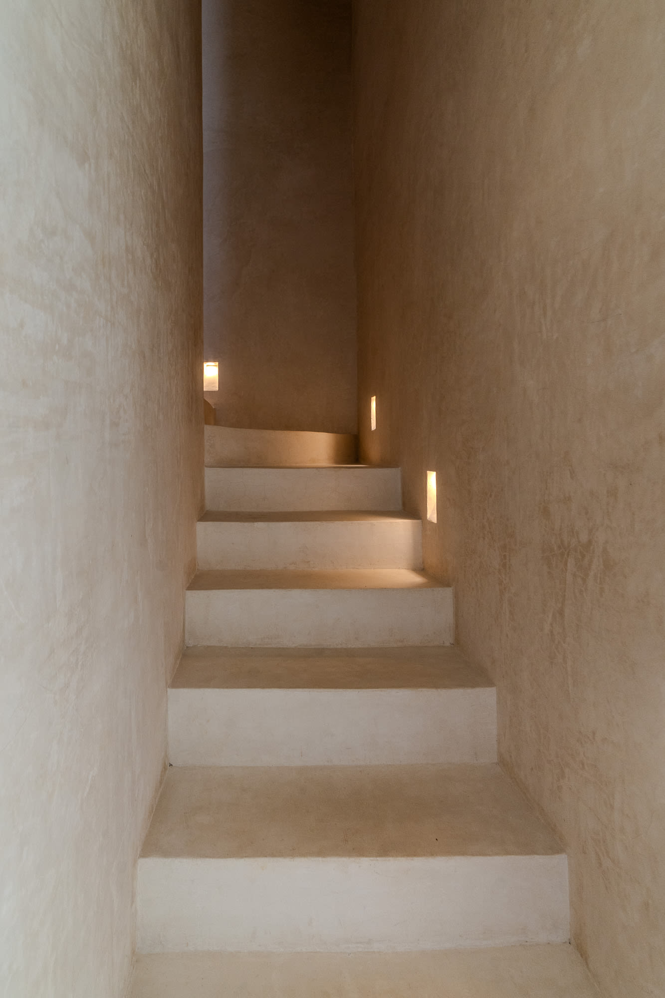 Elegant stairs leading to the second bedroom, adding charm and a sense of privacy to the space.
