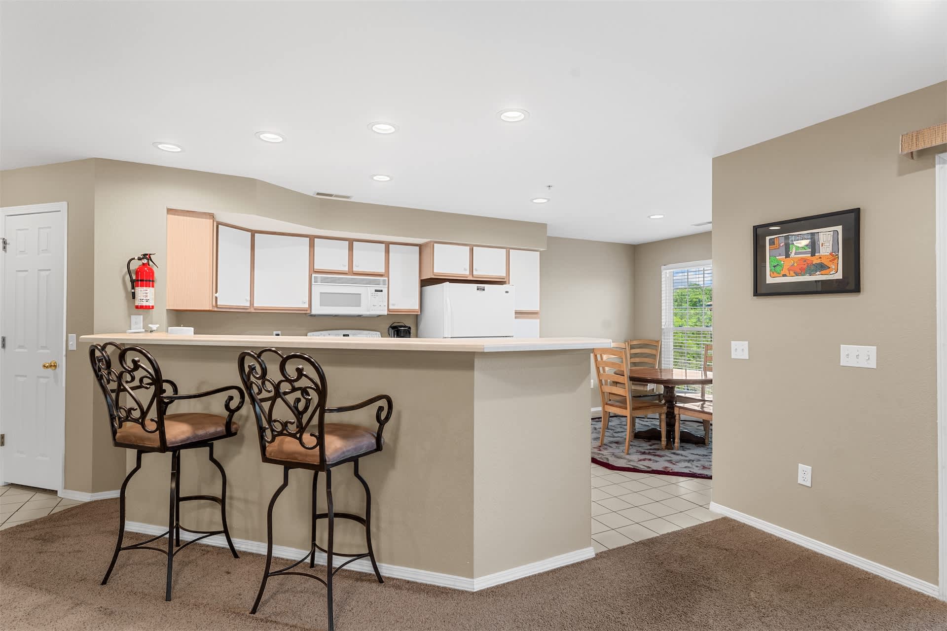 The open kitchen offers ample space & all the comforts of home​