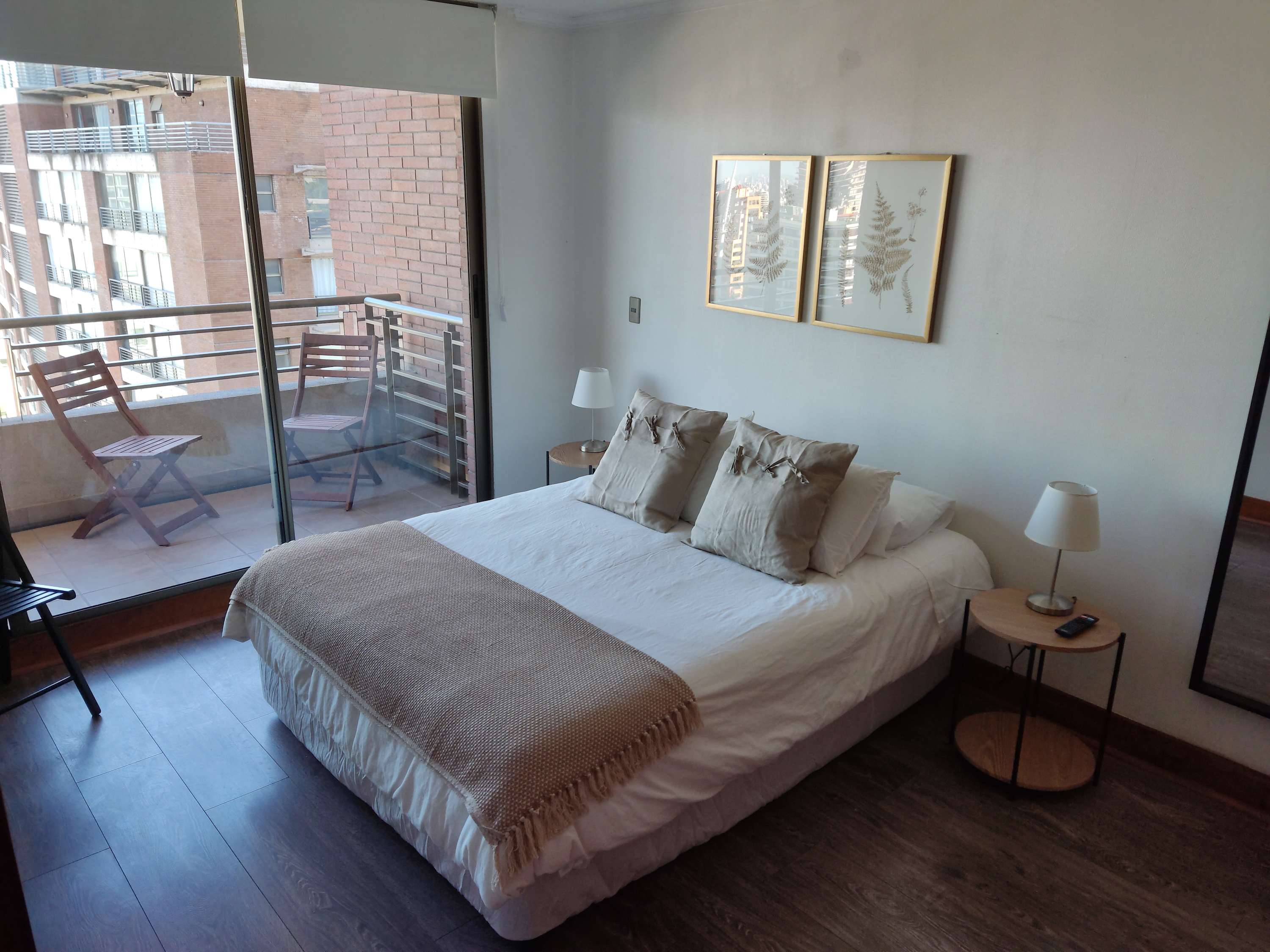 Relax in this cozy bedroom with a private balcony offering city views. Perfect for unwinding after a day of exploring.