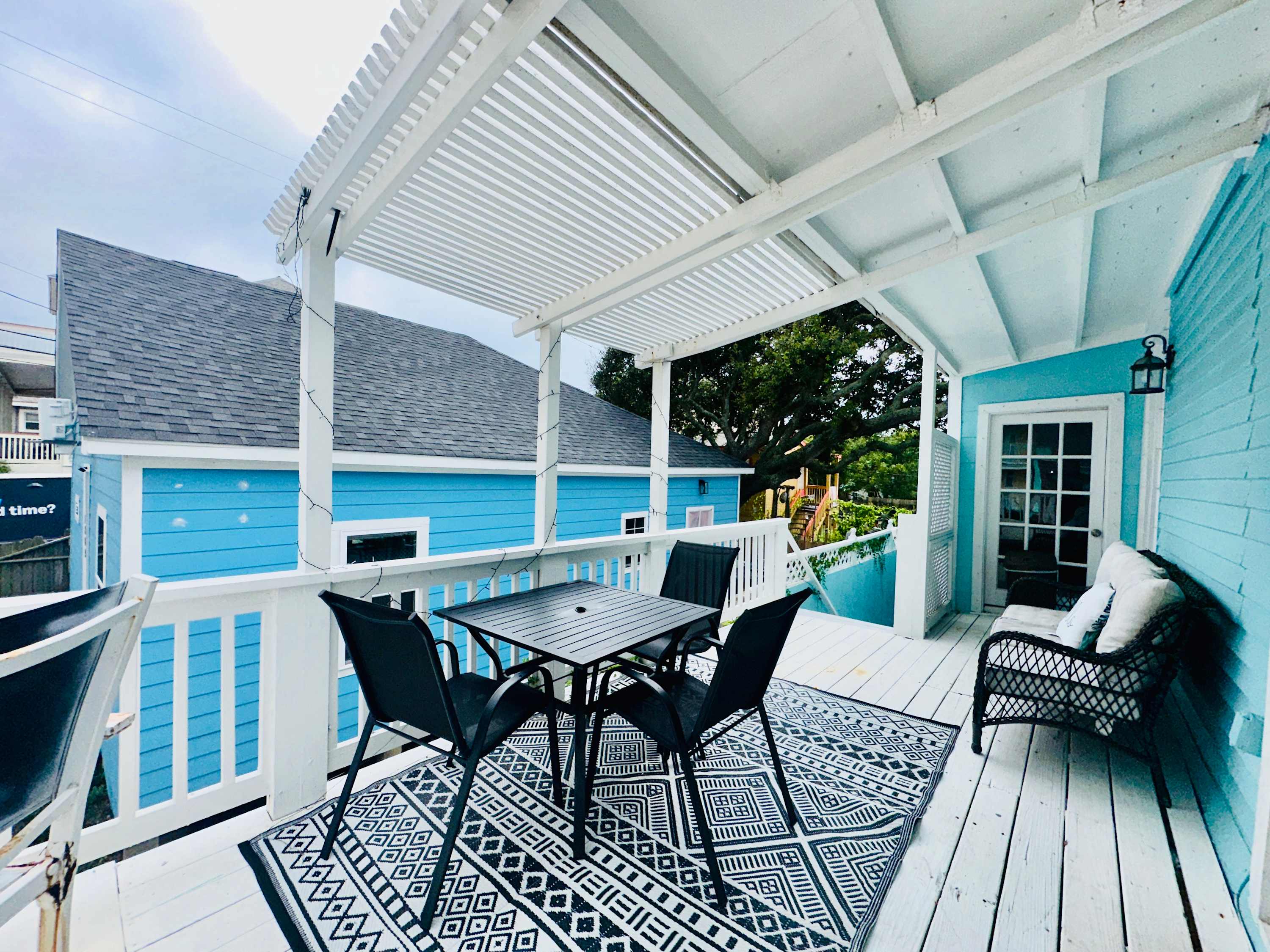 Relax on the upstairs patio with ample seating area where you can entertain or see the ocean.