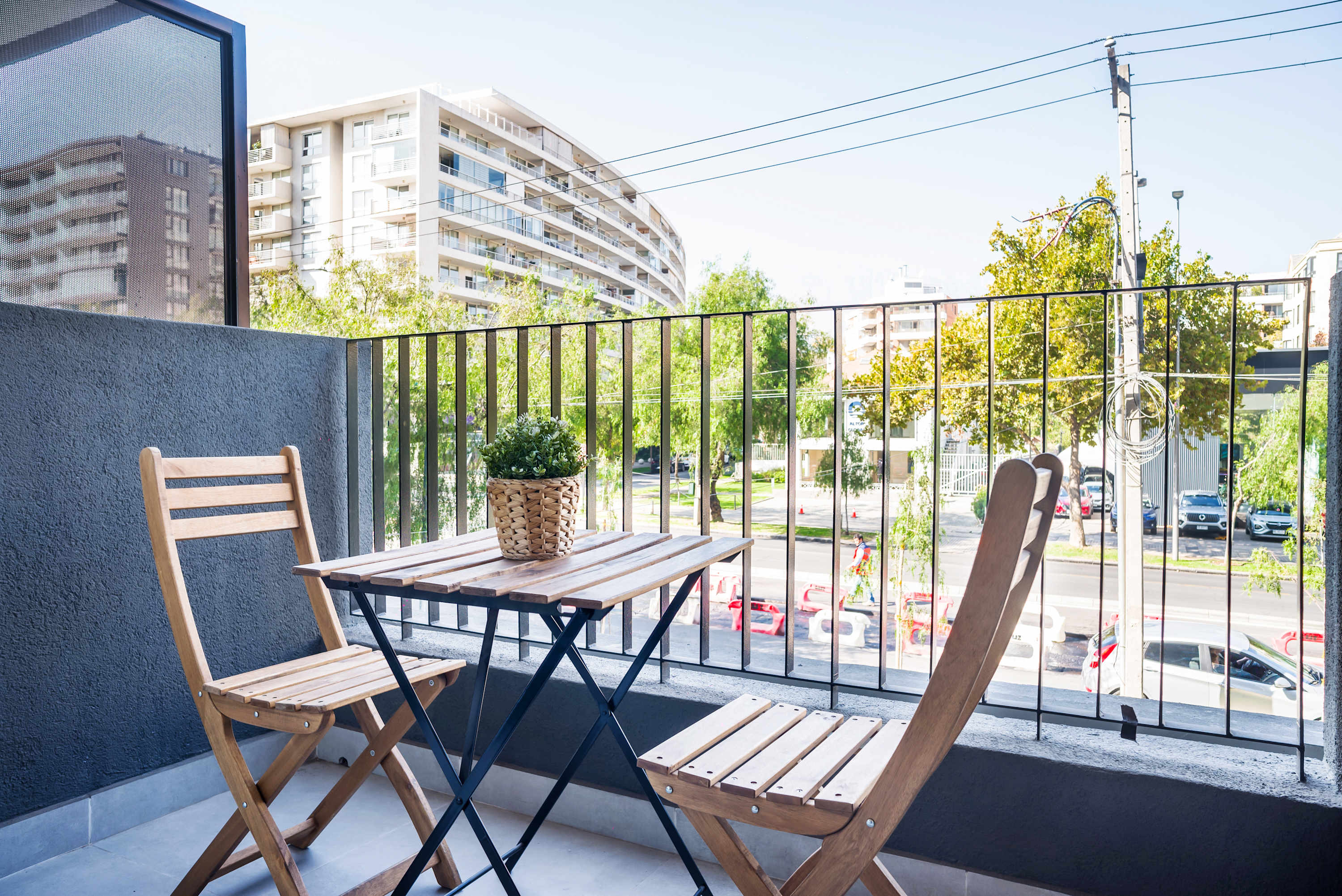 Enjoy your morning coffee on this charming balcony with city views, perfect for a relaxing start to your day.