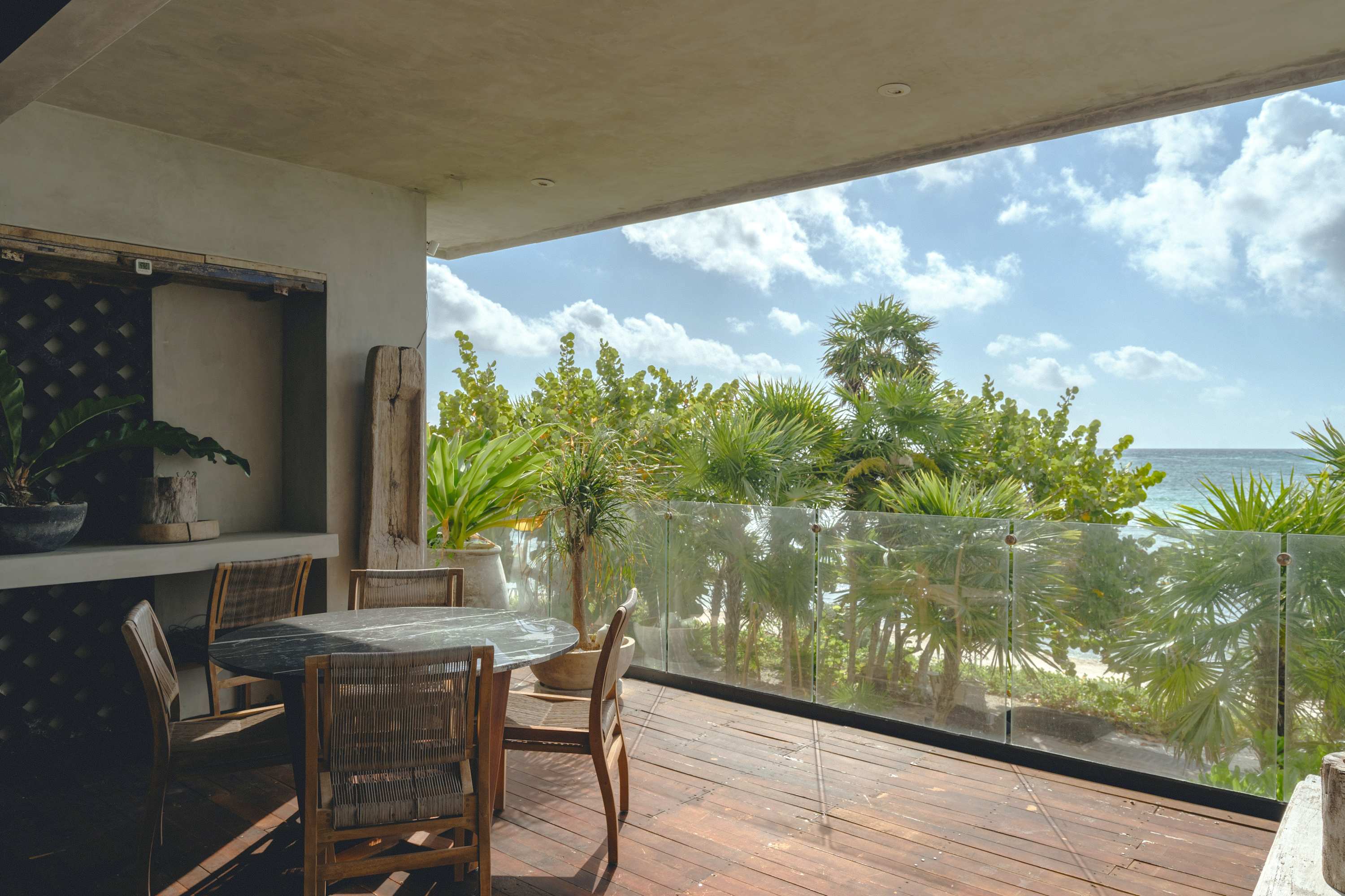 Private balcony with ocean view and outdoor dining area