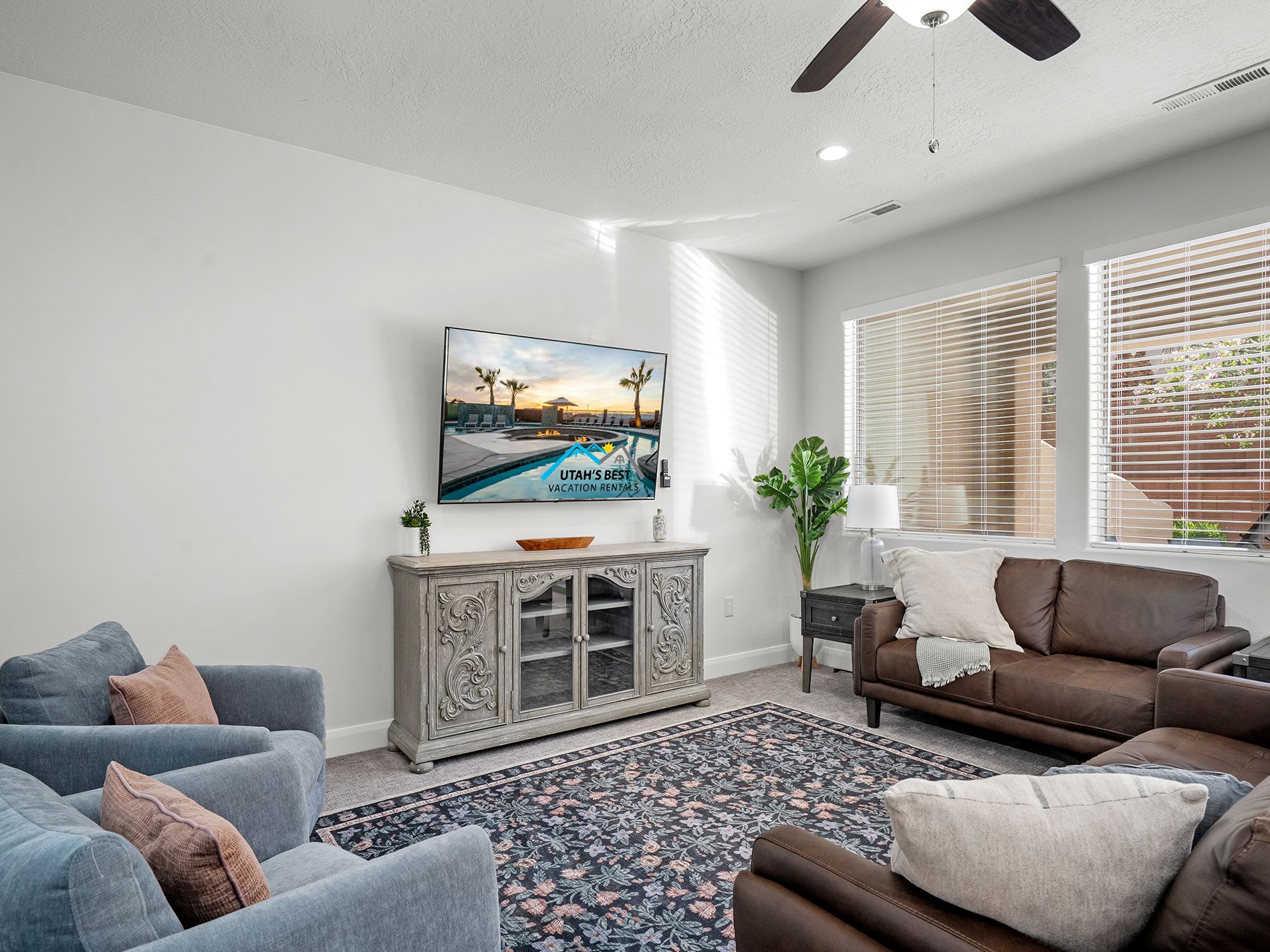 Main living room with plenty of seating and natural light.