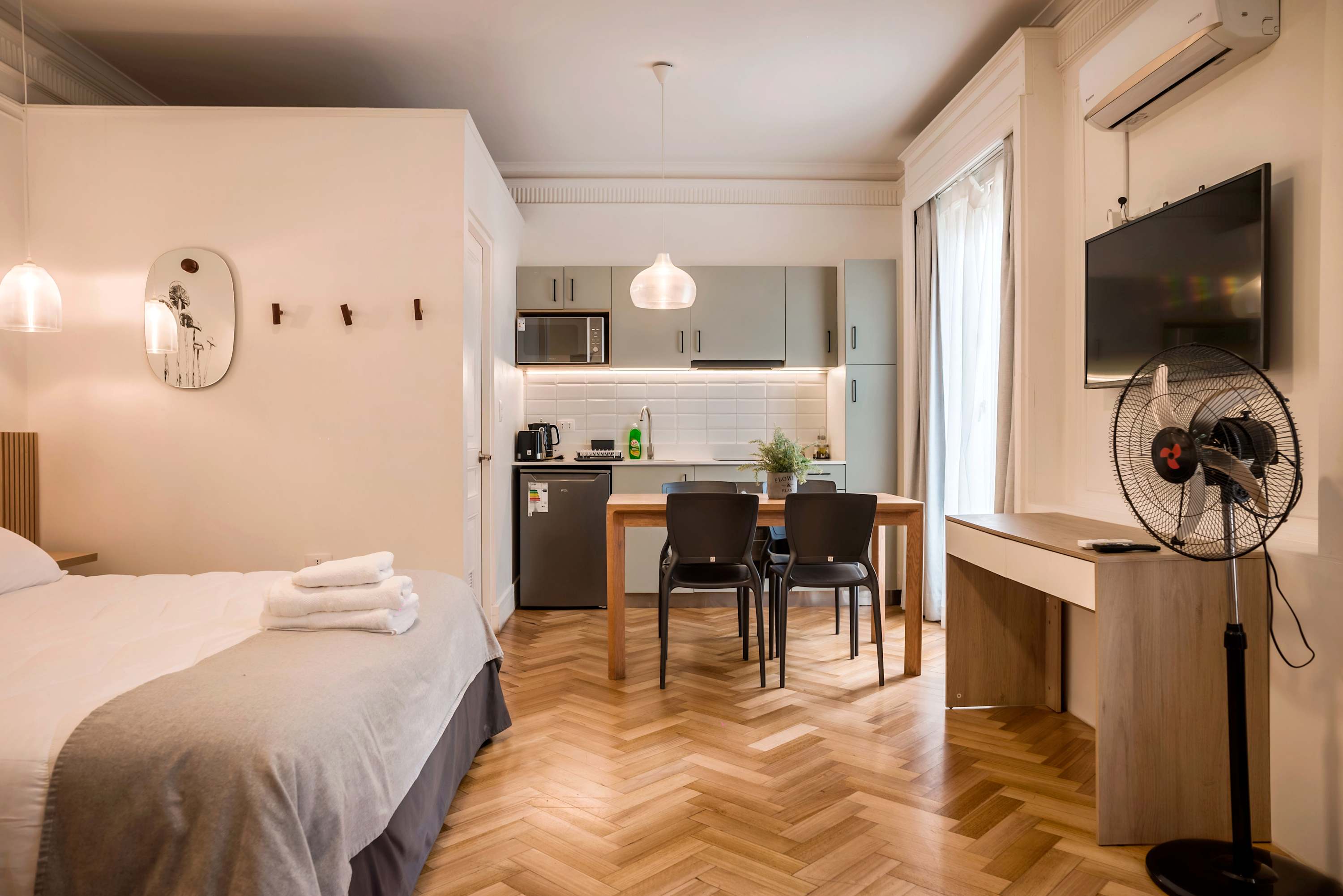 Cozy studio with modern kitchen and dining area, perfect for a comfortable stay in the heart of the city.
