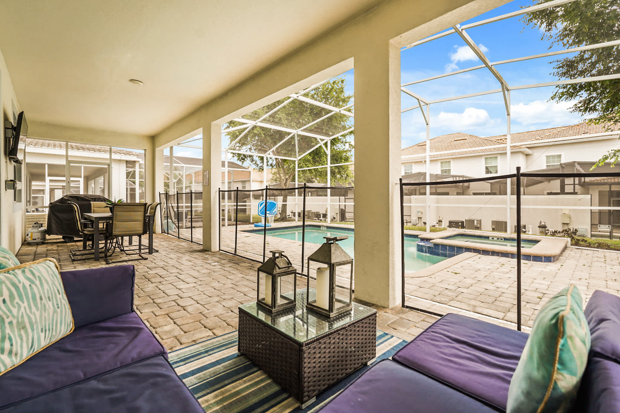 Relax in the spacious patio with comfy seating, a grill, and a private pool with a hot tub—perfect for gatherings or unwinding.