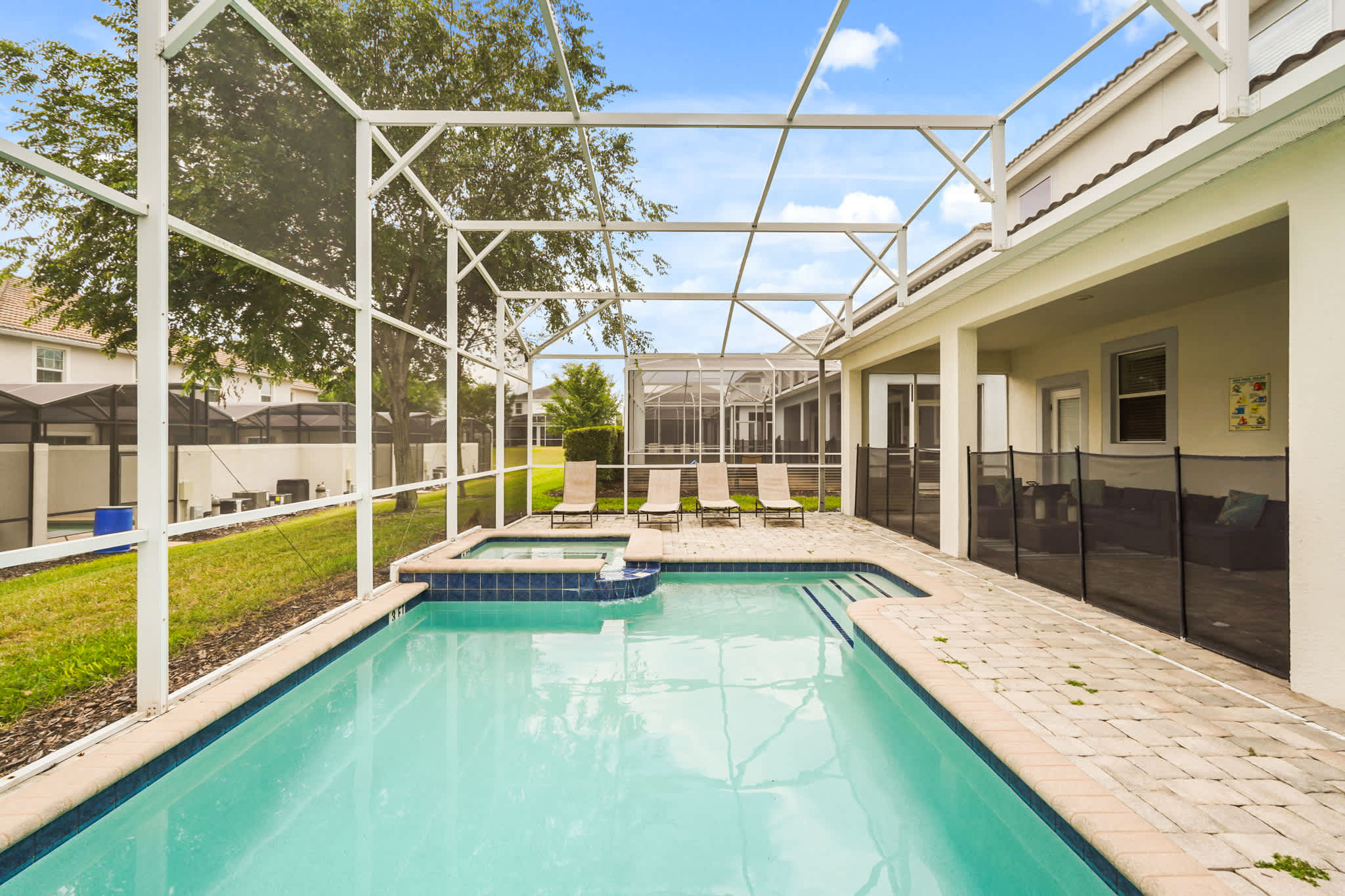 Relax by your private pool and spa in this spacious villa, perfect for unwinding under the sun.