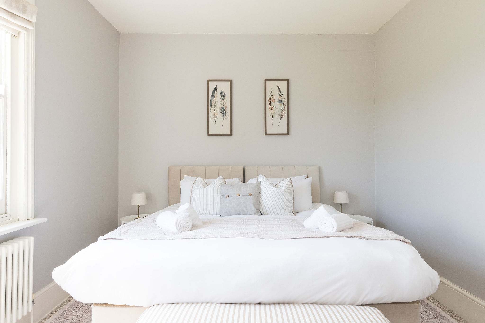 Soft, calming bedroom designed for restful countryside stays.