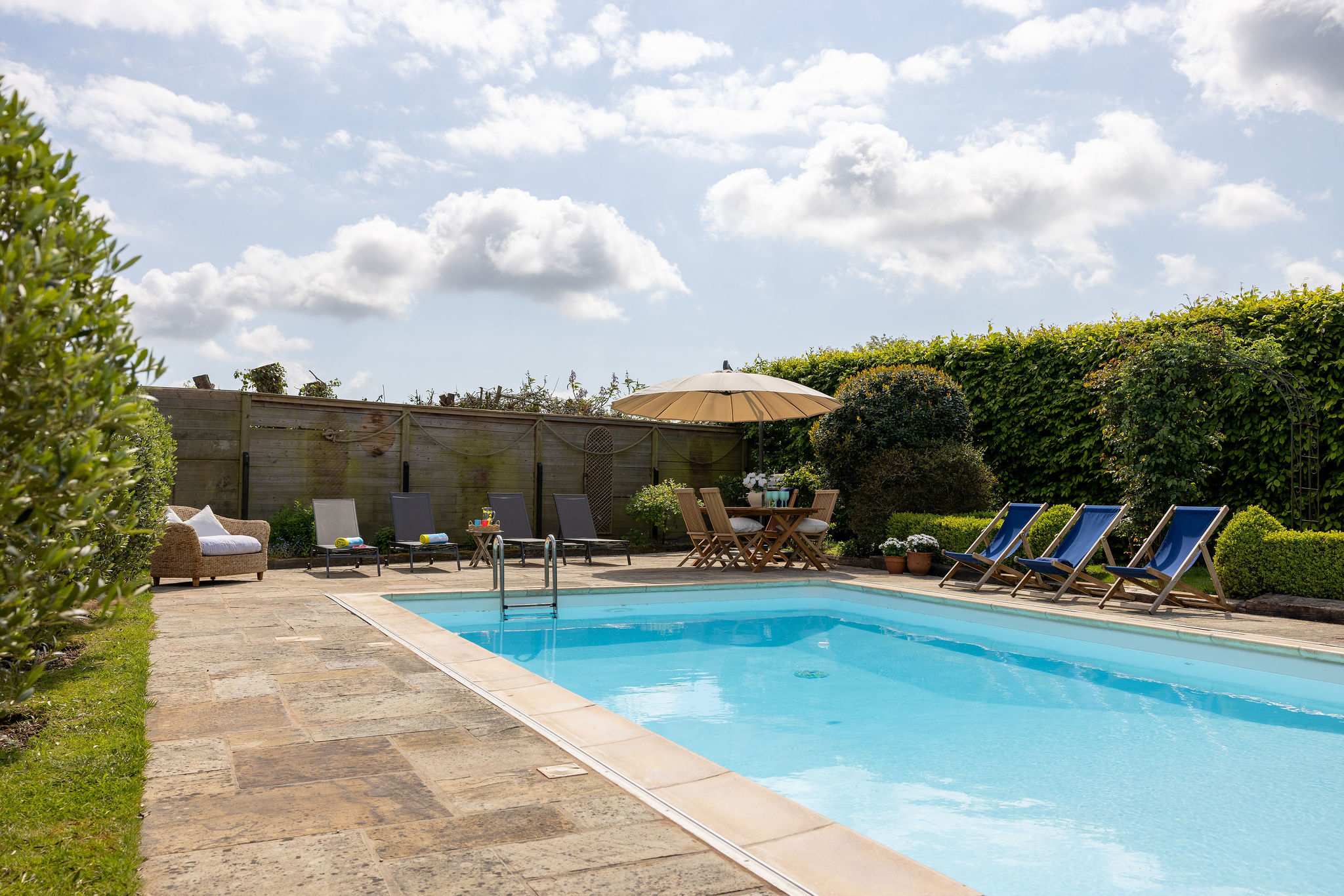 Sunny poolside space perfect for relaxed outdoor living.
