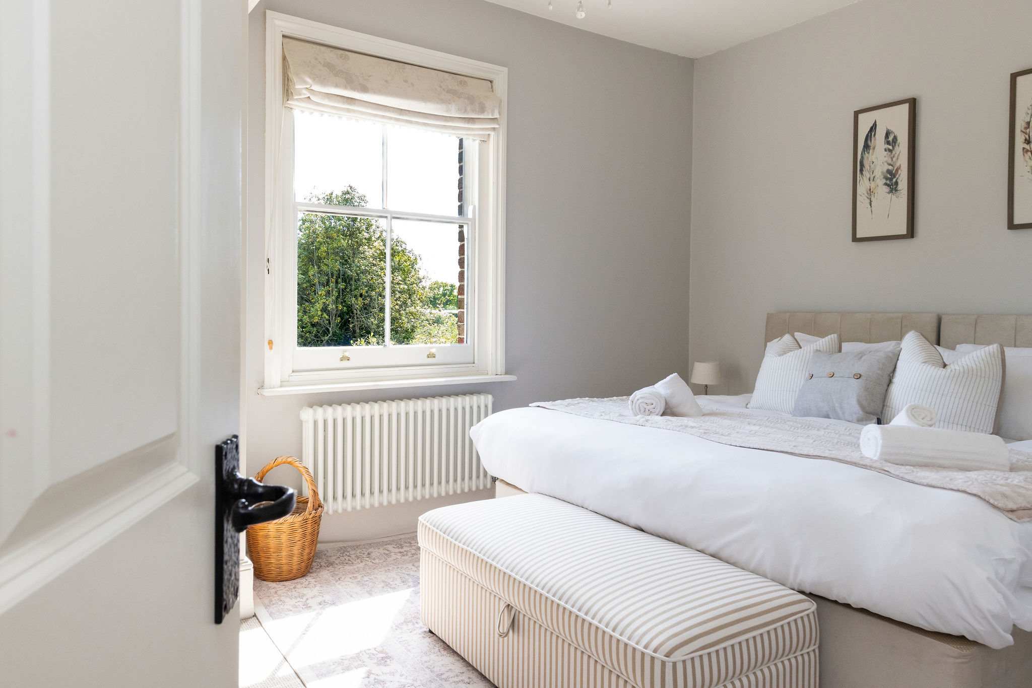 Bright and restful bedroom with peaceful garden outlooks.