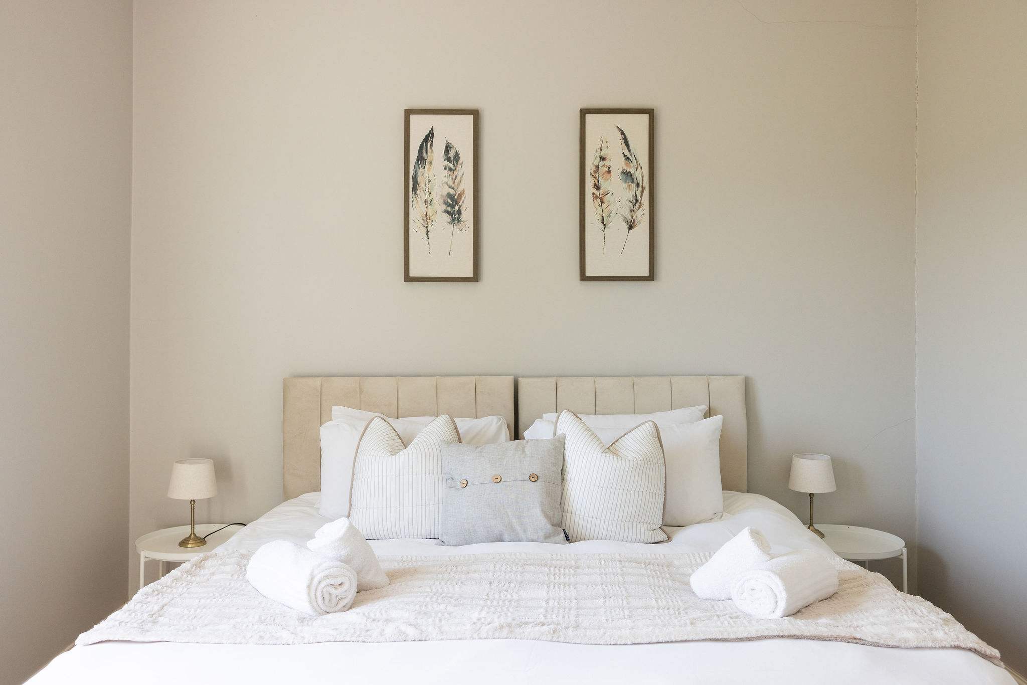 Soft neutral bedroom designed for comfort and relaxation.