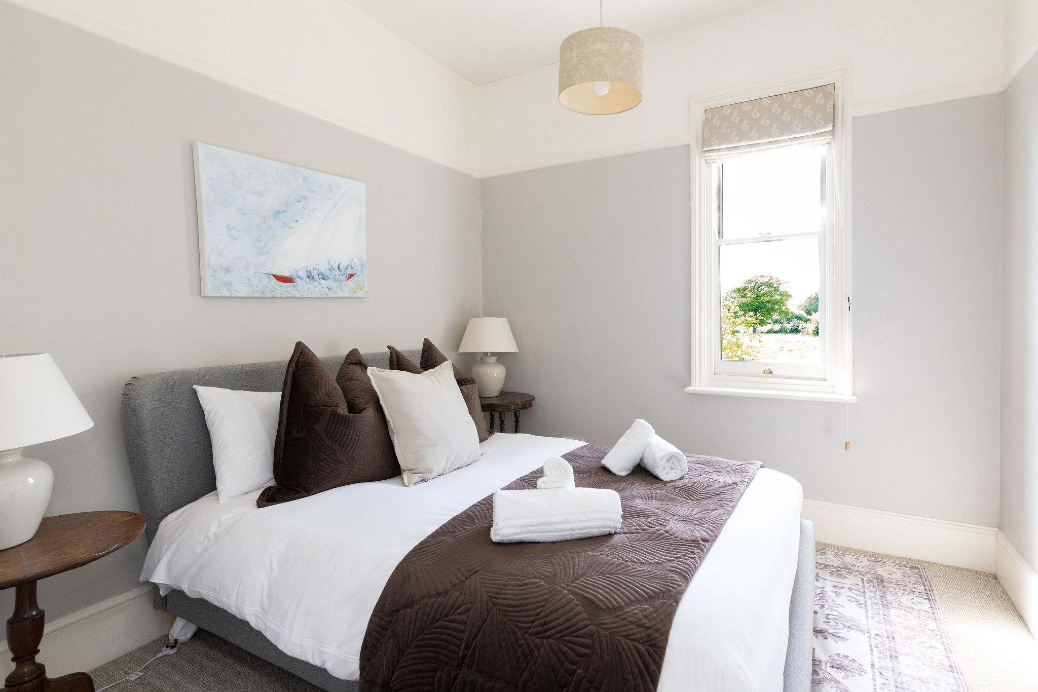 Comfortable double bedroom with soft neutral styling.
