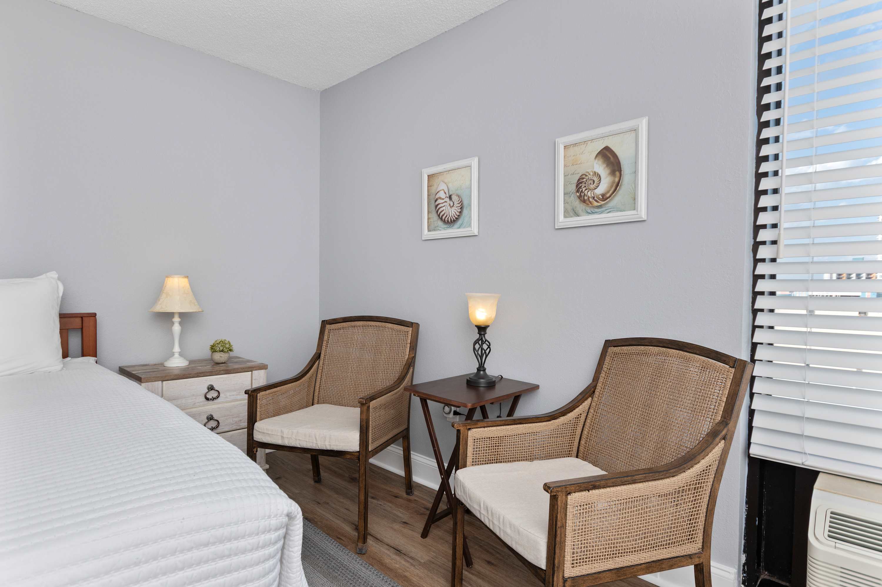 Recharge in a peaceful bedroom filled with soft textures, beachy accents, and inviting natural light.