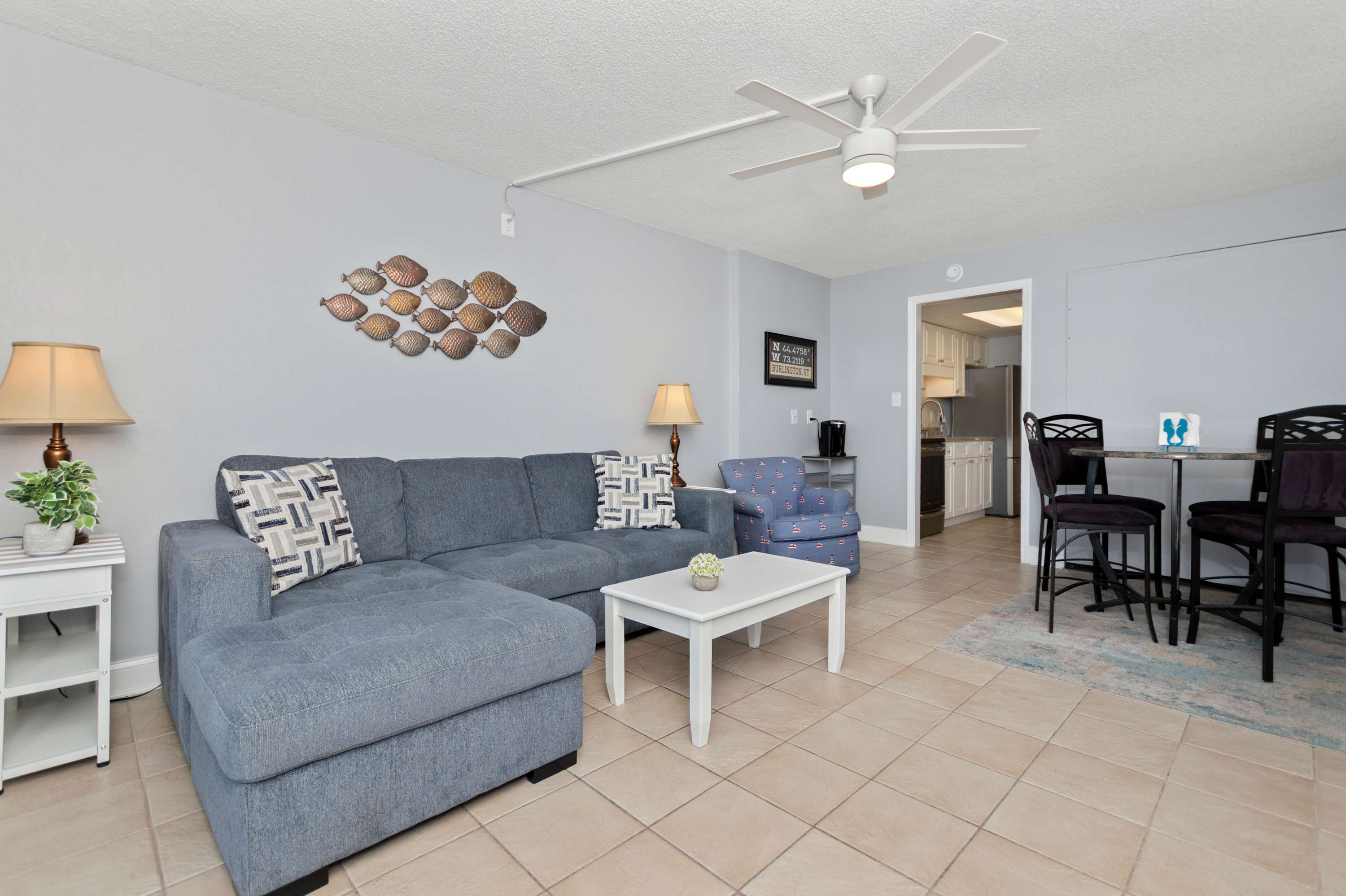 Gather together after beach adventures in this cozy and inviting coastal retreat.