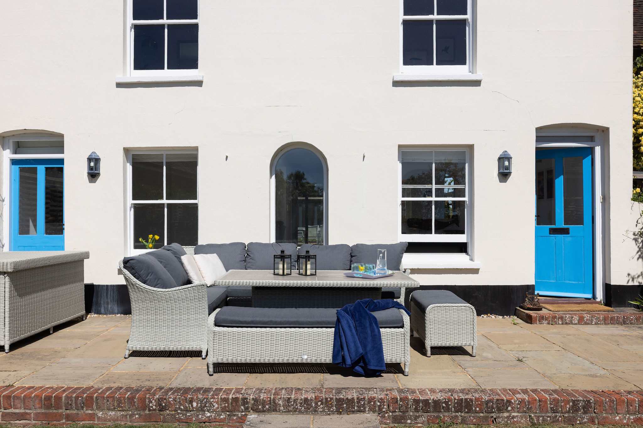 Sunny outdoor seating beside the house