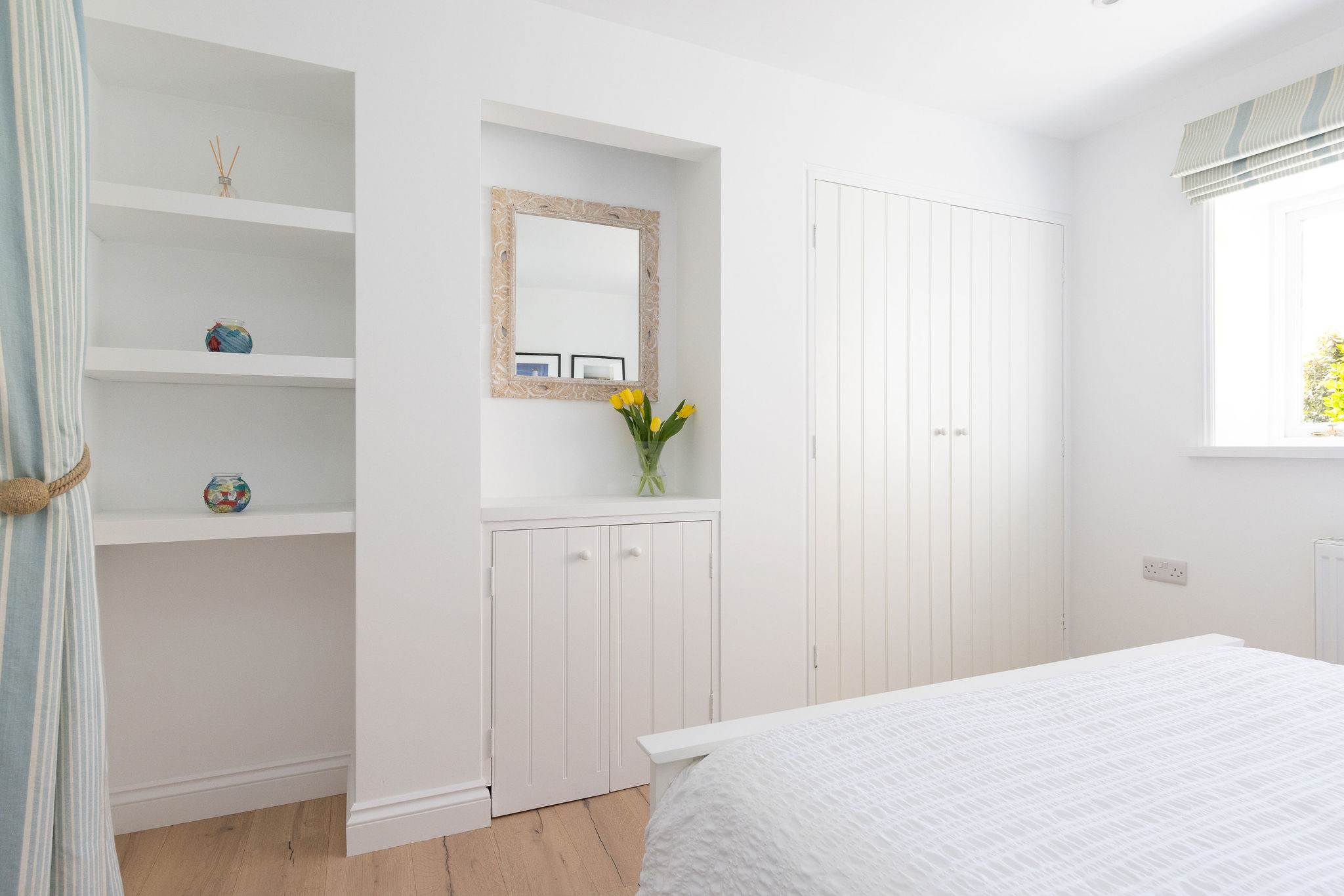 Peaceful bedroom with soft coastal styling
