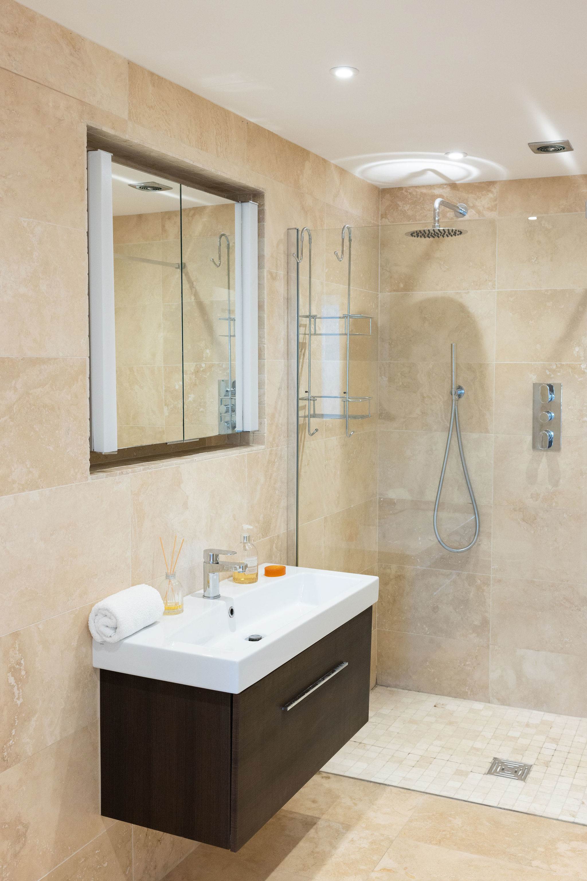 Modern walk-in downstairs shower room