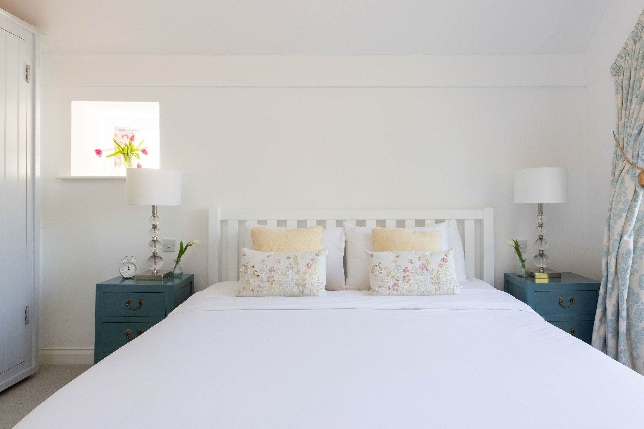 Comfortable master bedroom with fresh white linen