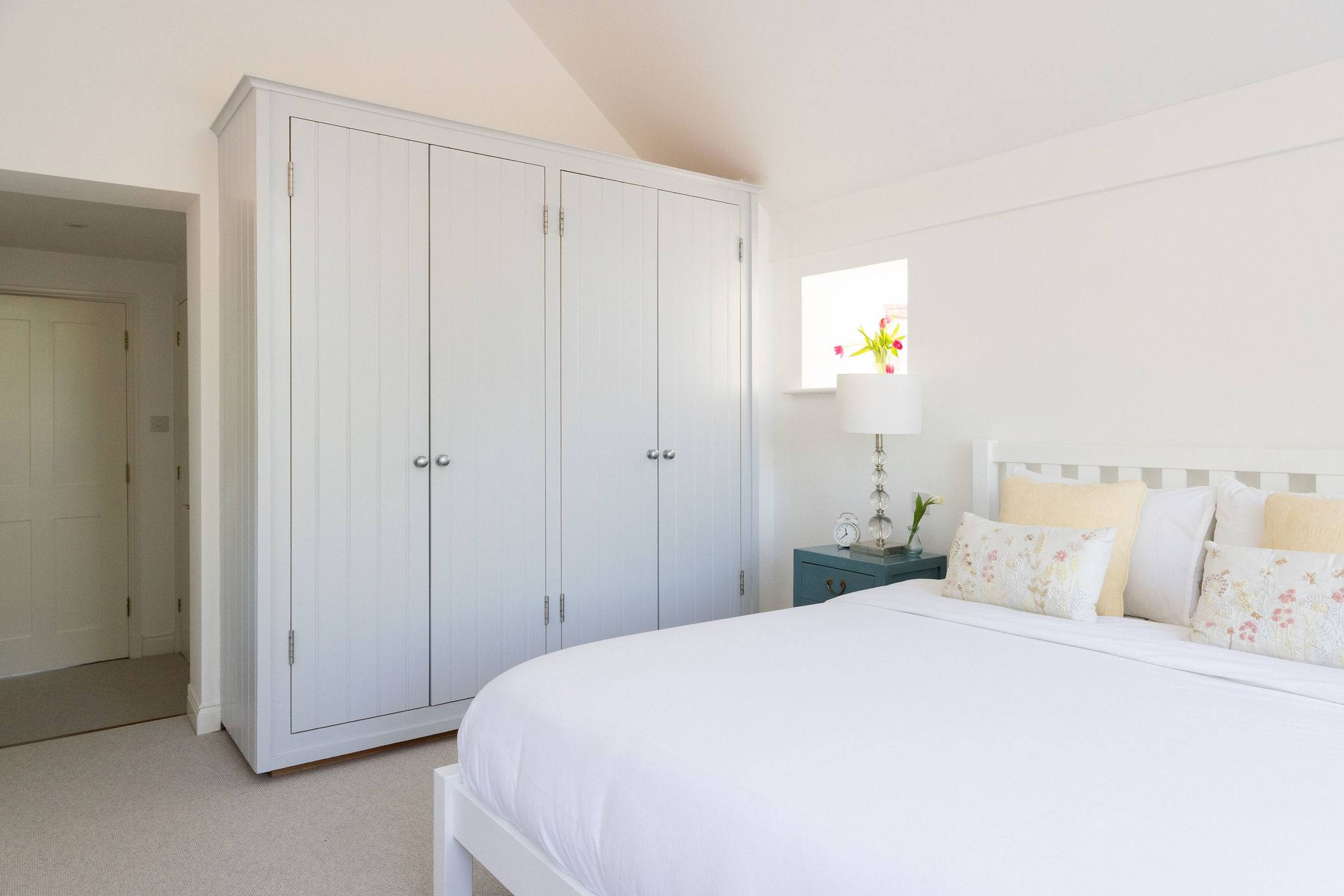 Spacious master bedroom with elegant coastal touches
